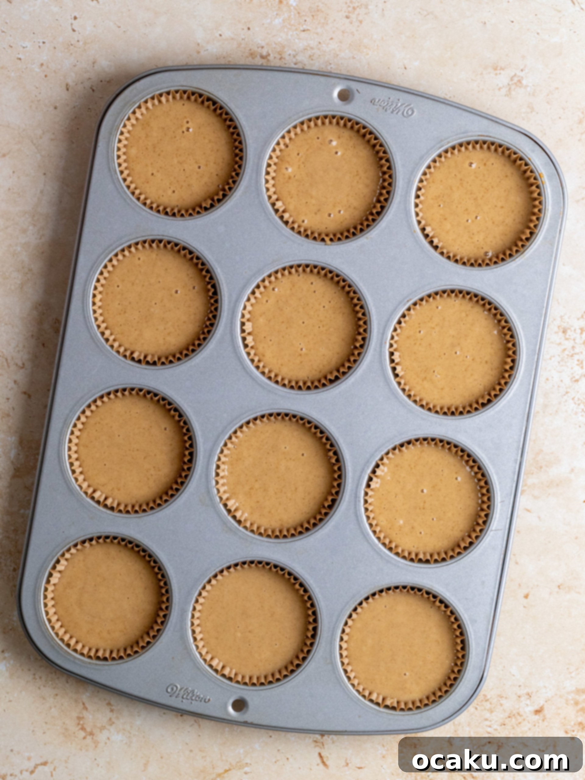 Step-by-step image of cupcake batter in liners.