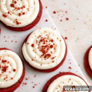 Red Velvet Cookies with Cream Cheese Frosting on a white plate