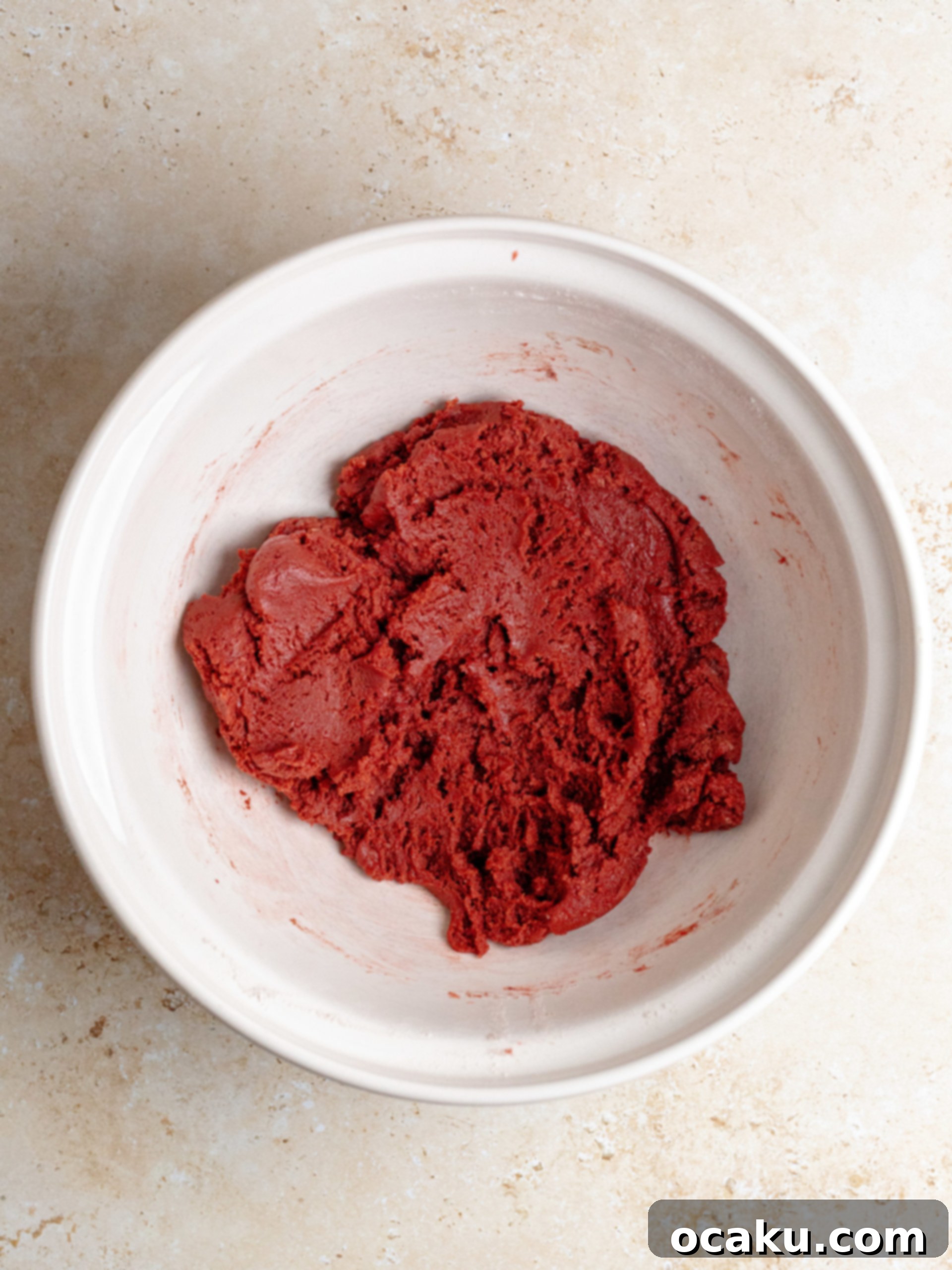 Wet ingredients for red velvet cookies being whisked