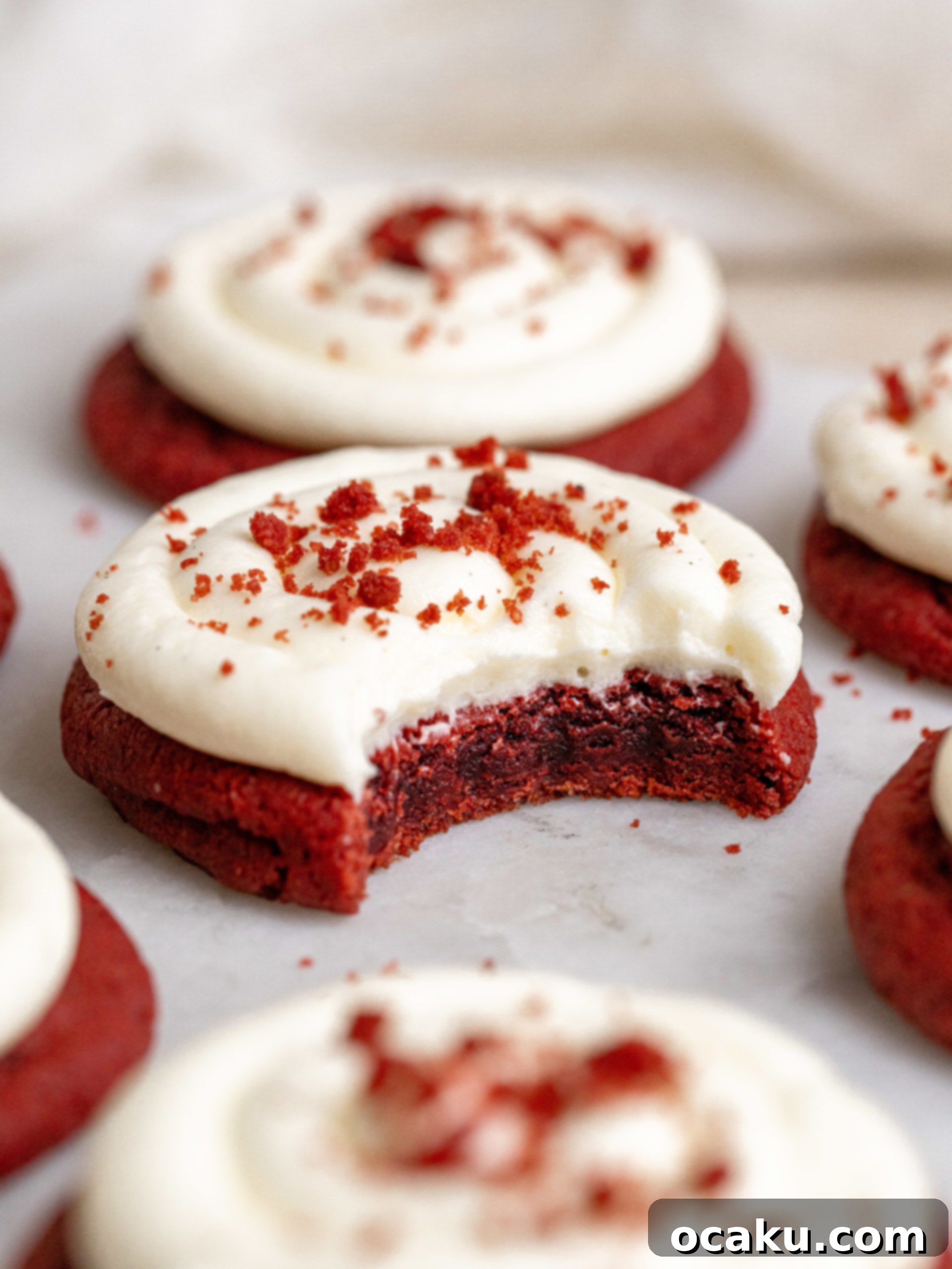 A close-up of a single Red Velvet Cookie with Cream Cheese Frosting