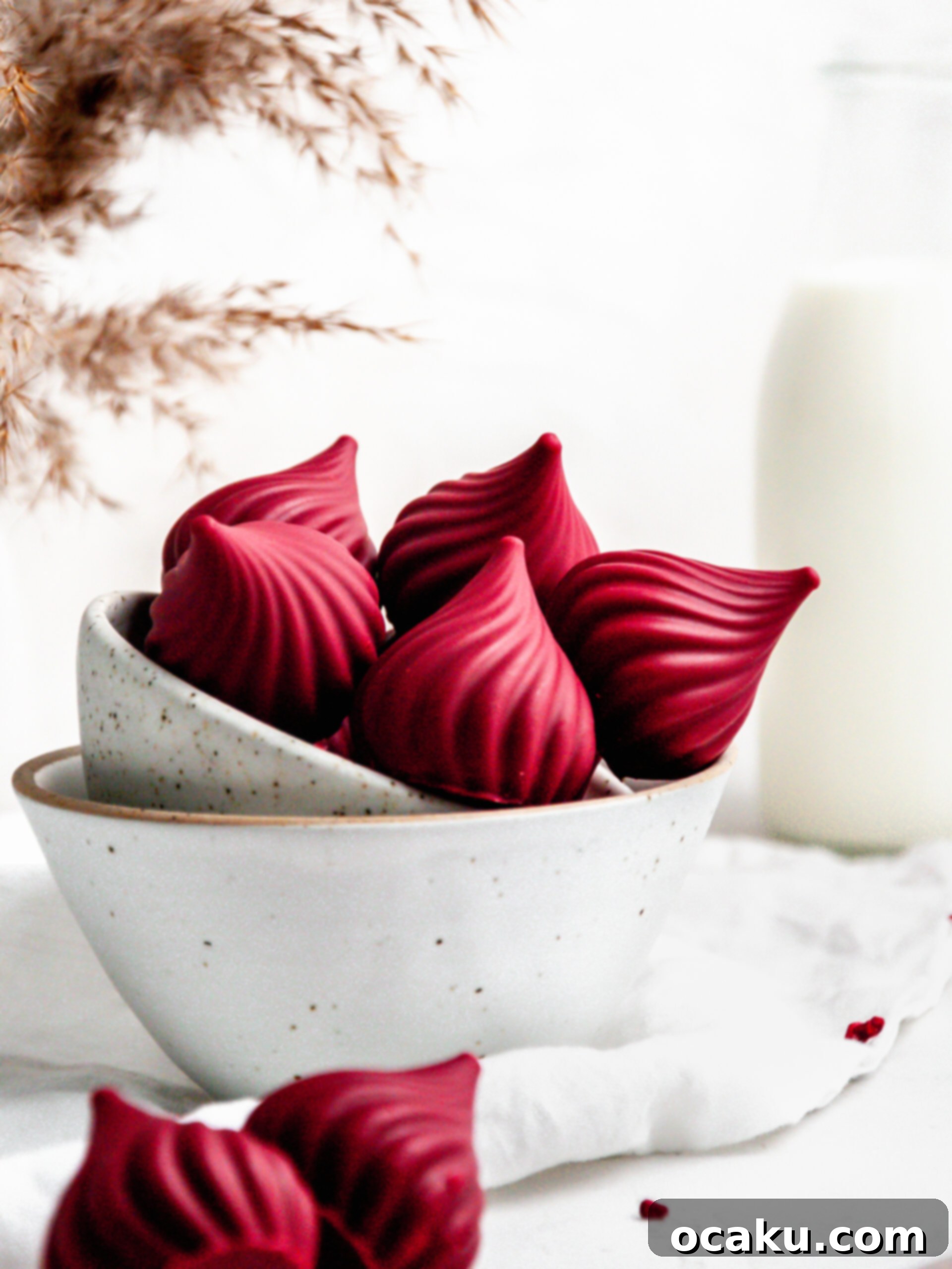 An array of raspberry cream puffs beautifully arranged on a tray, ready for serving.