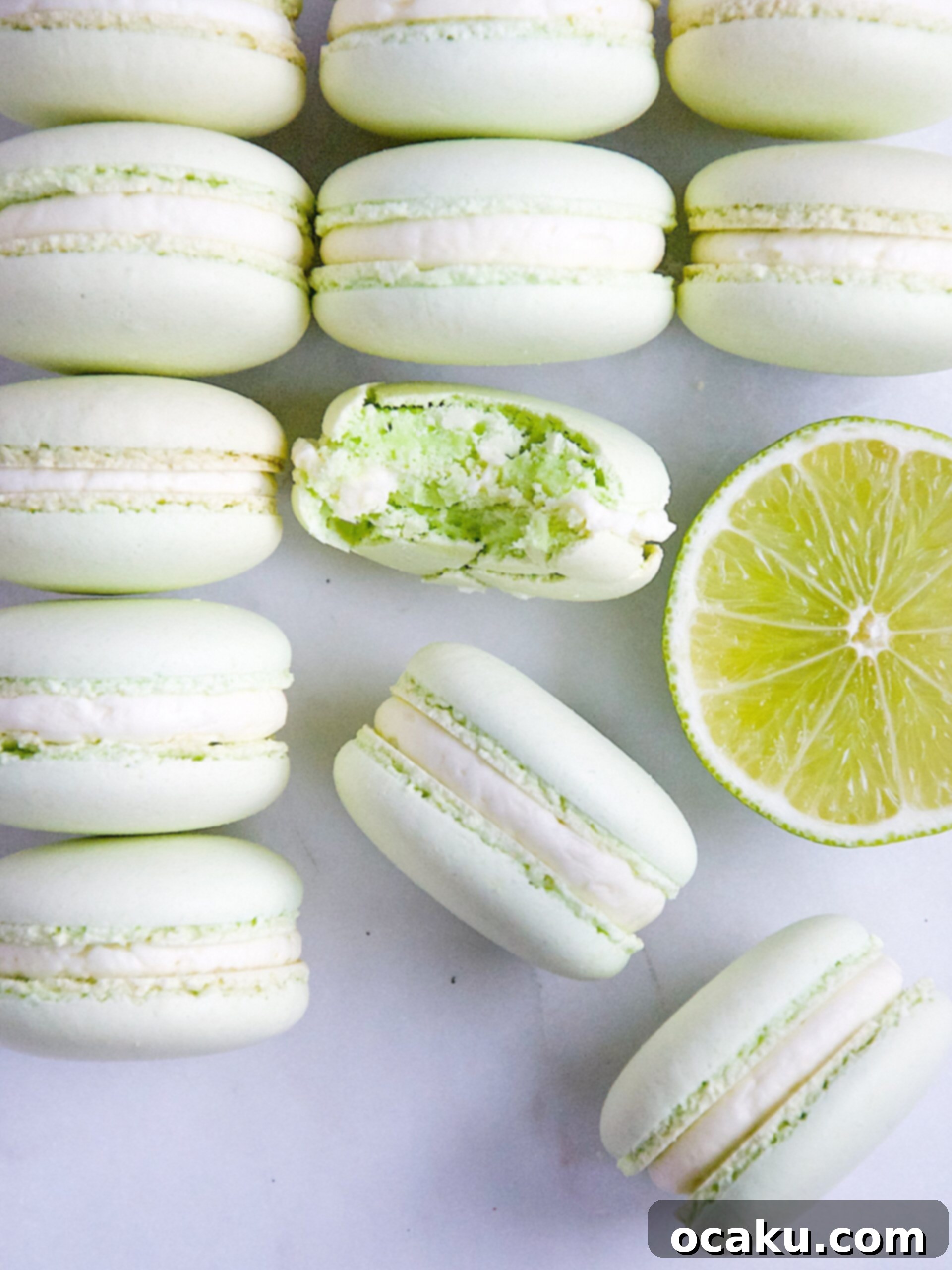 Sunshine Lime Macarons 3 Close-up of baked macaron shells with distinct 'feet' on a cooling rack.