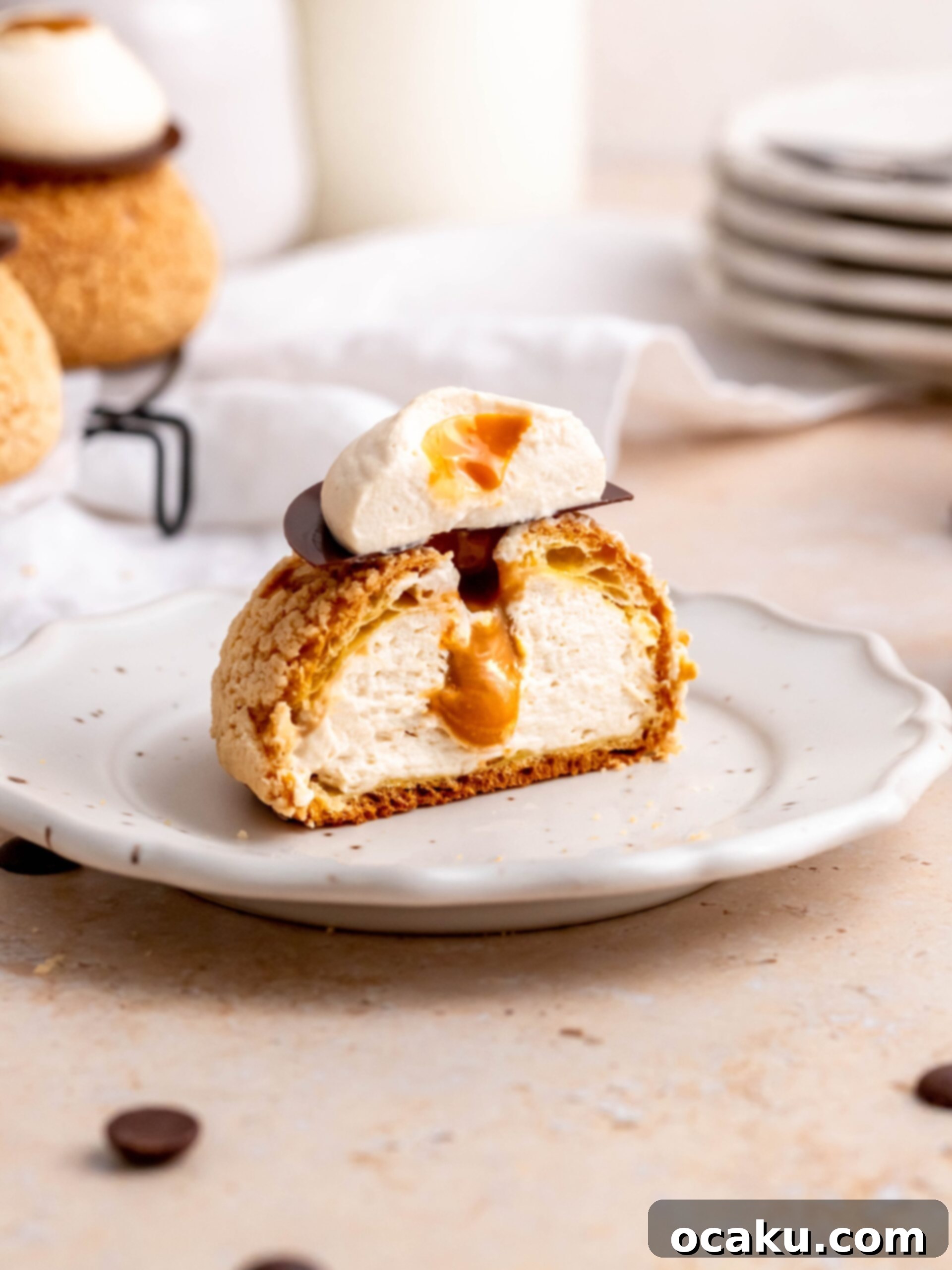 Choux au Craquelin with Coffee and Salted Dulce de Leche on a plate, showcasing its crispy top and creamy filling.