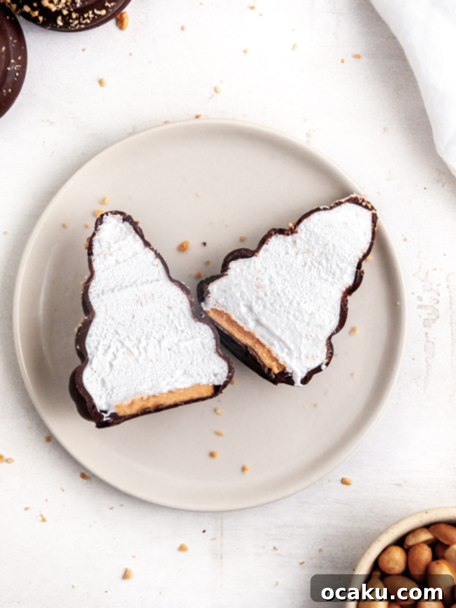 Reeses peanut butter cream puffs showcasing the perfect layers when cut in half.