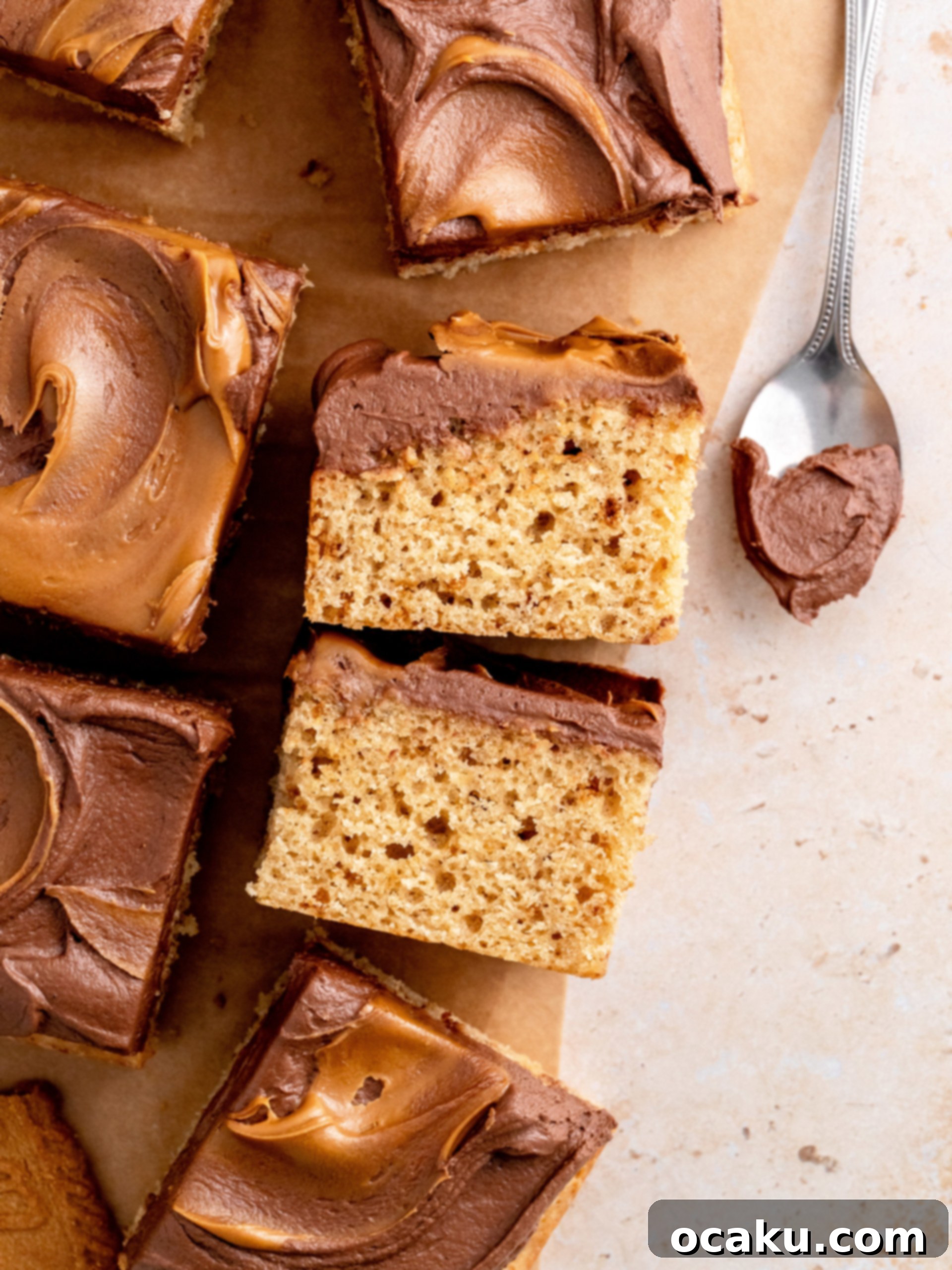 Biscoff Dream Cake 12 The ultimate Biscoff cake, frosted with chocolate buttercream and decorated with Biscoff cookies, presented on a cake stand.