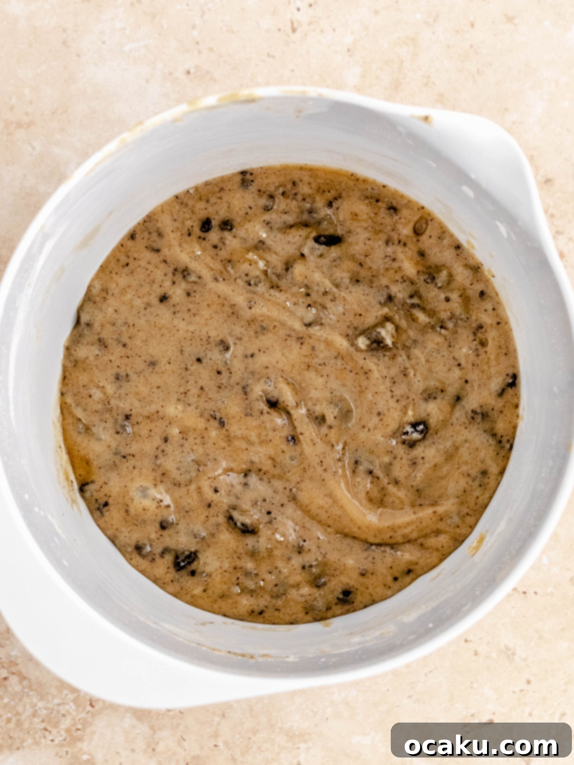 Oreo Cookie dough in a bowl, ready to be layered.