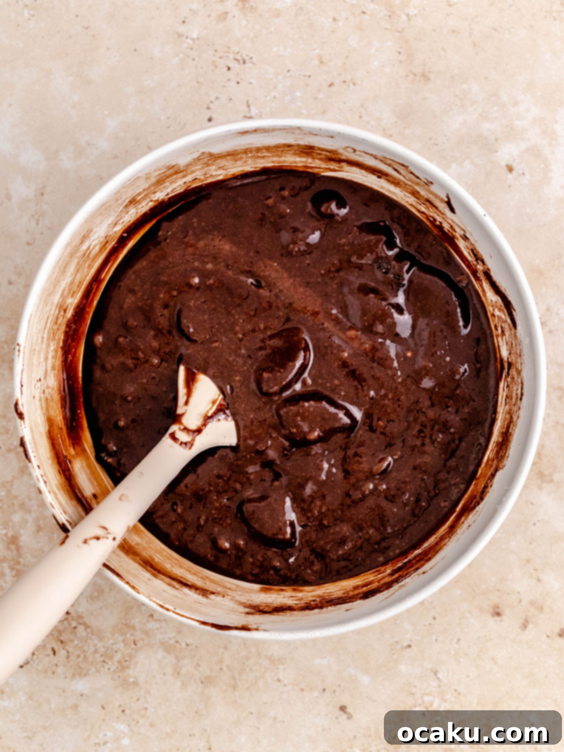 Rich Oreo brownie batter in a mixing bowl.