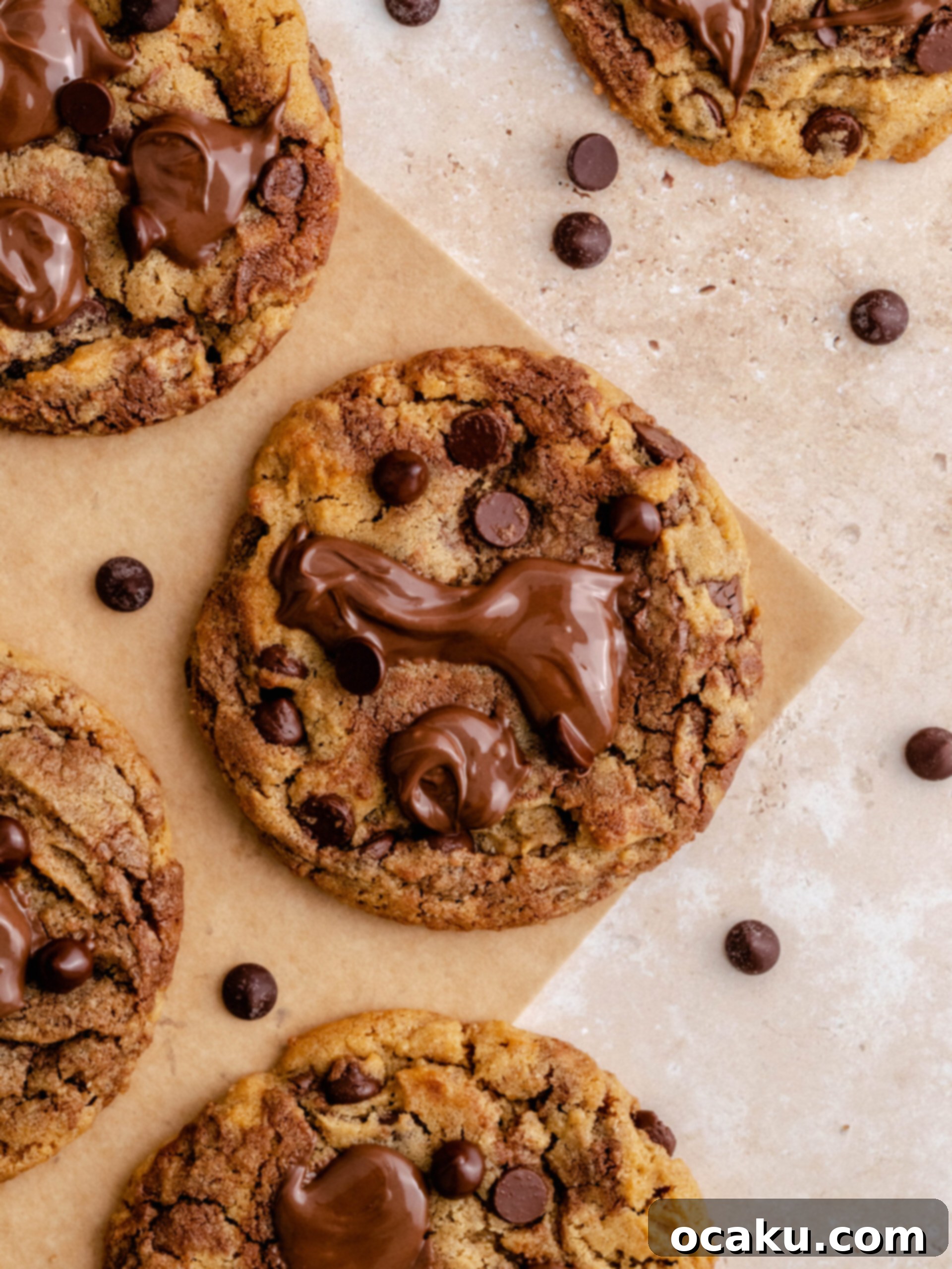 Nutella Peanut Butter Swirl Cookies 2 Nutella peanut butter cookies with dollops of Nutella on top of them, glistening and inviting.
