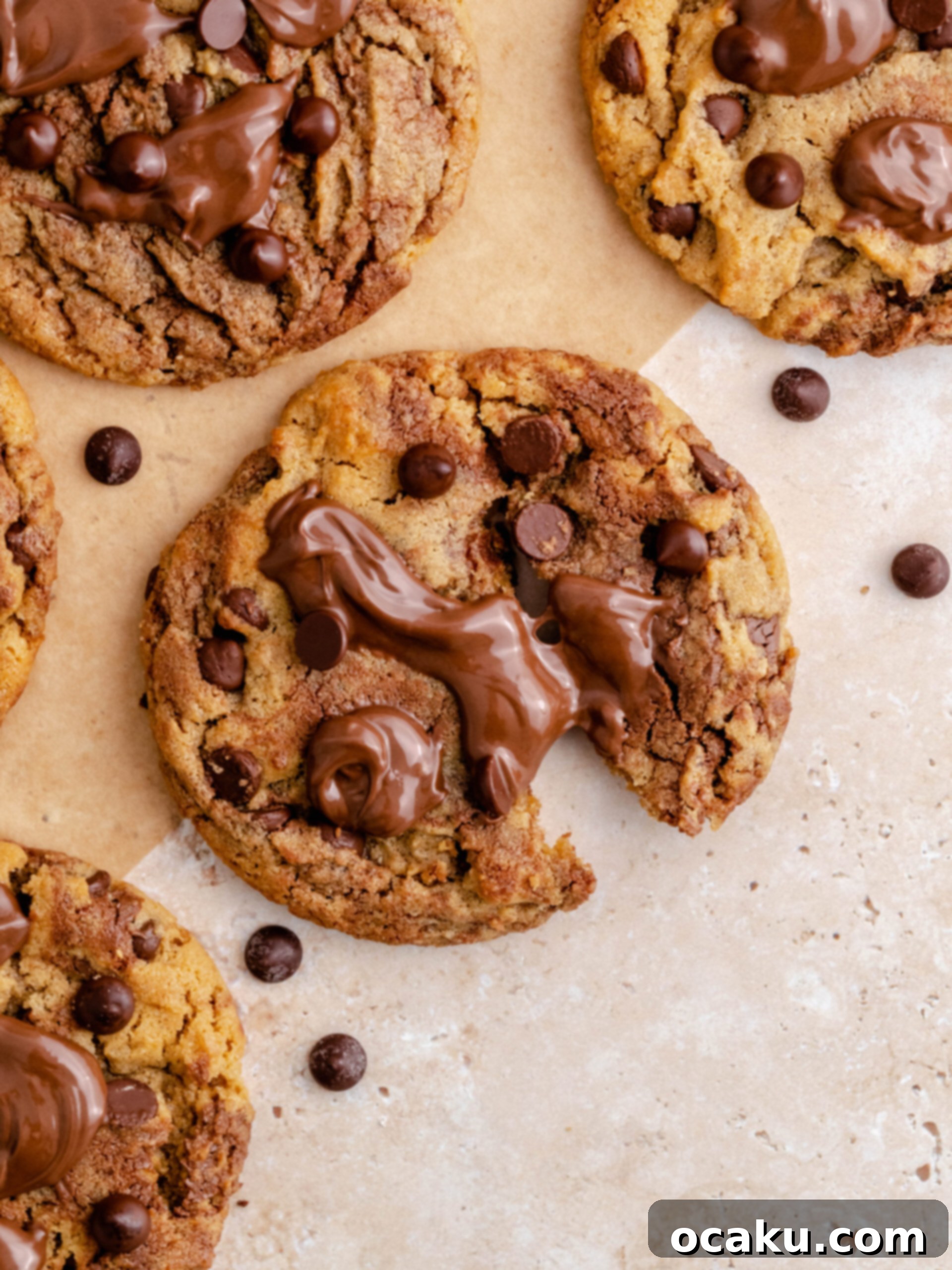 Nutella Peanut Butter Swirl Cookies 13 A close-up of a Nutella peanut butter cookie, freshly broken to reveal its soft, textured interior.