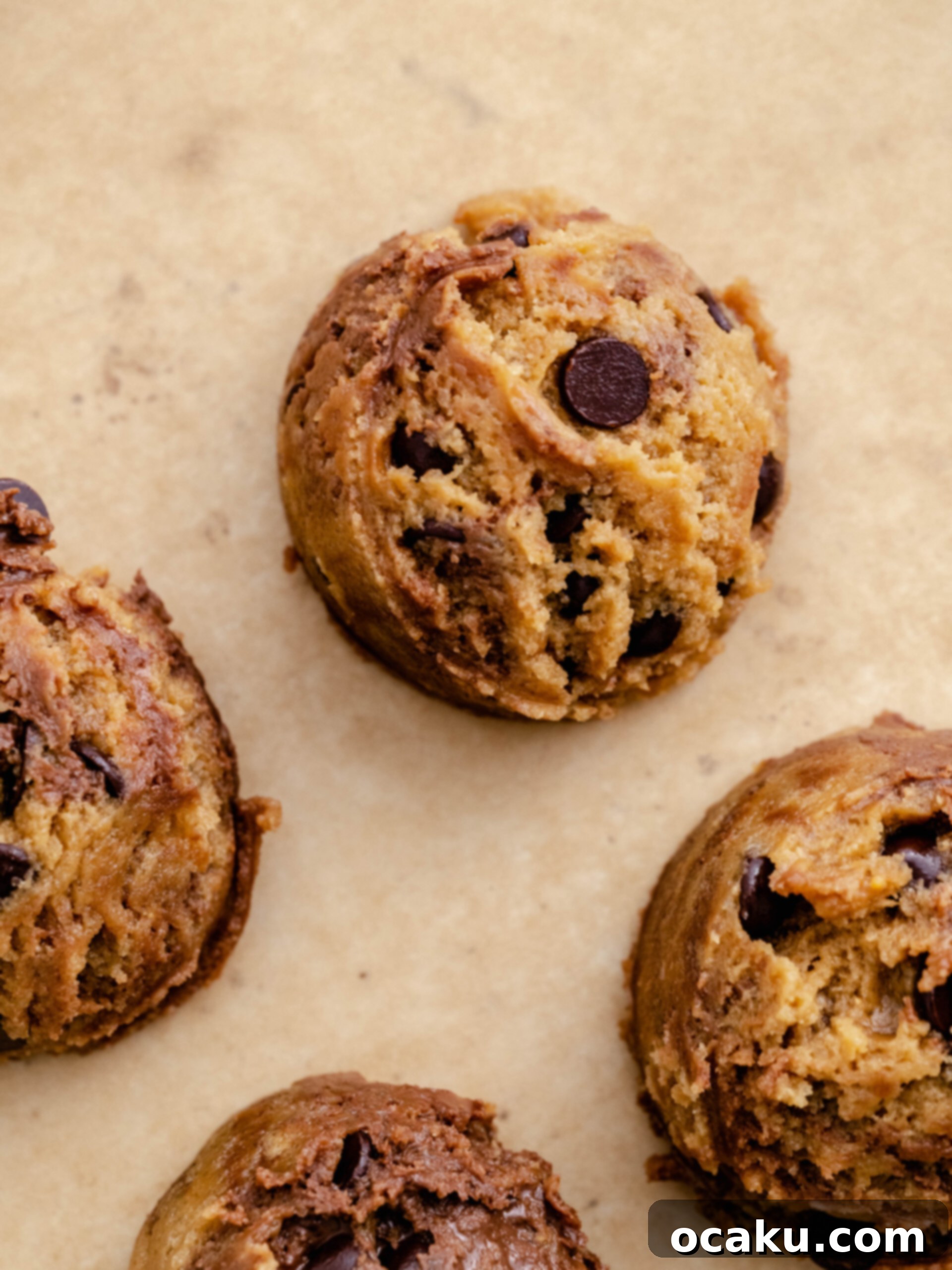Nutella Peanut Butter Swirl Cookies 10 Uniform scoops of Nutella peanut butter cookie dough placed on a baking sheet, spaced apart for baking.