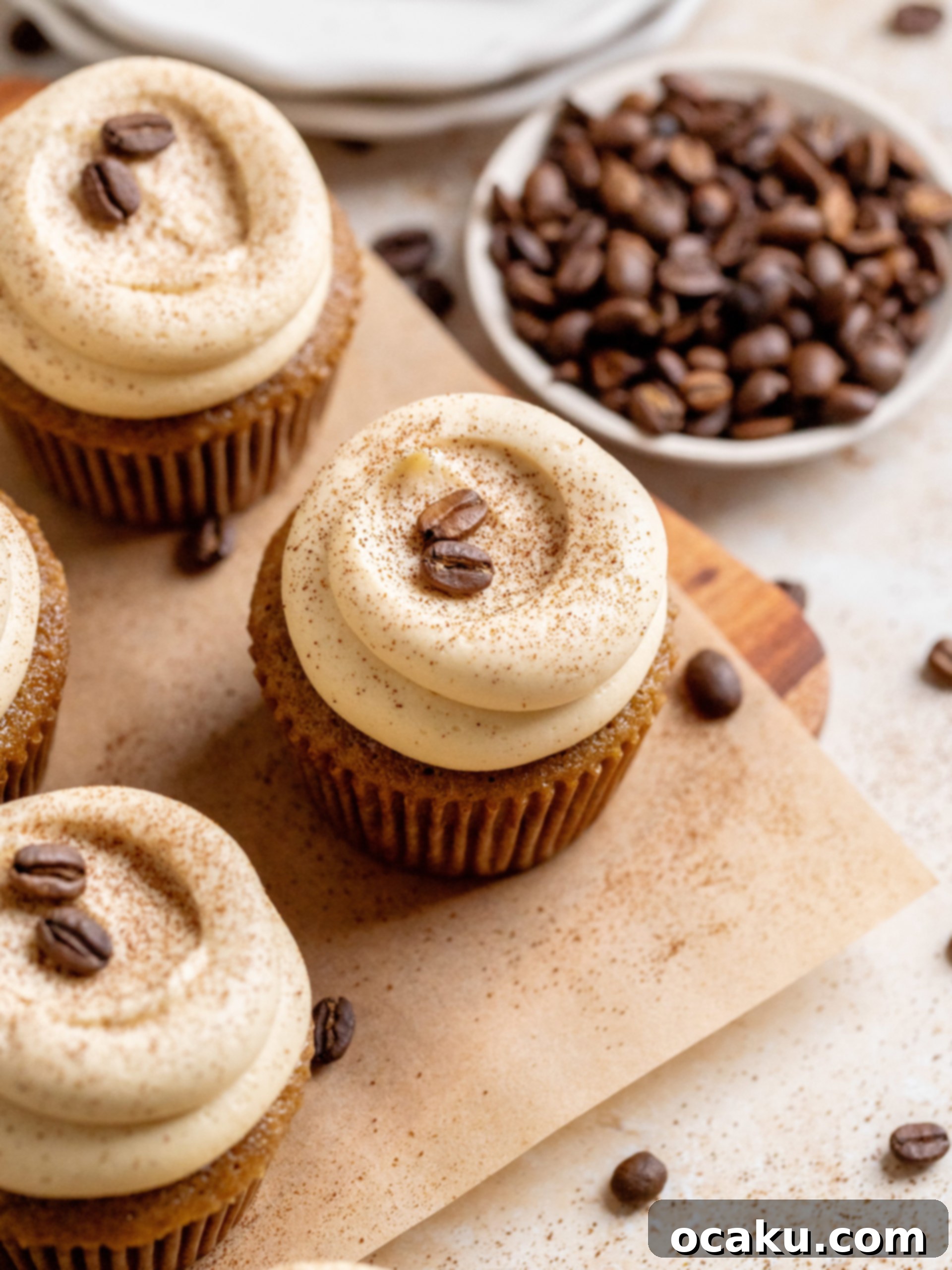 Freshly baked coffee cupcakes with a rich brown hue, perfect for a coffee break.