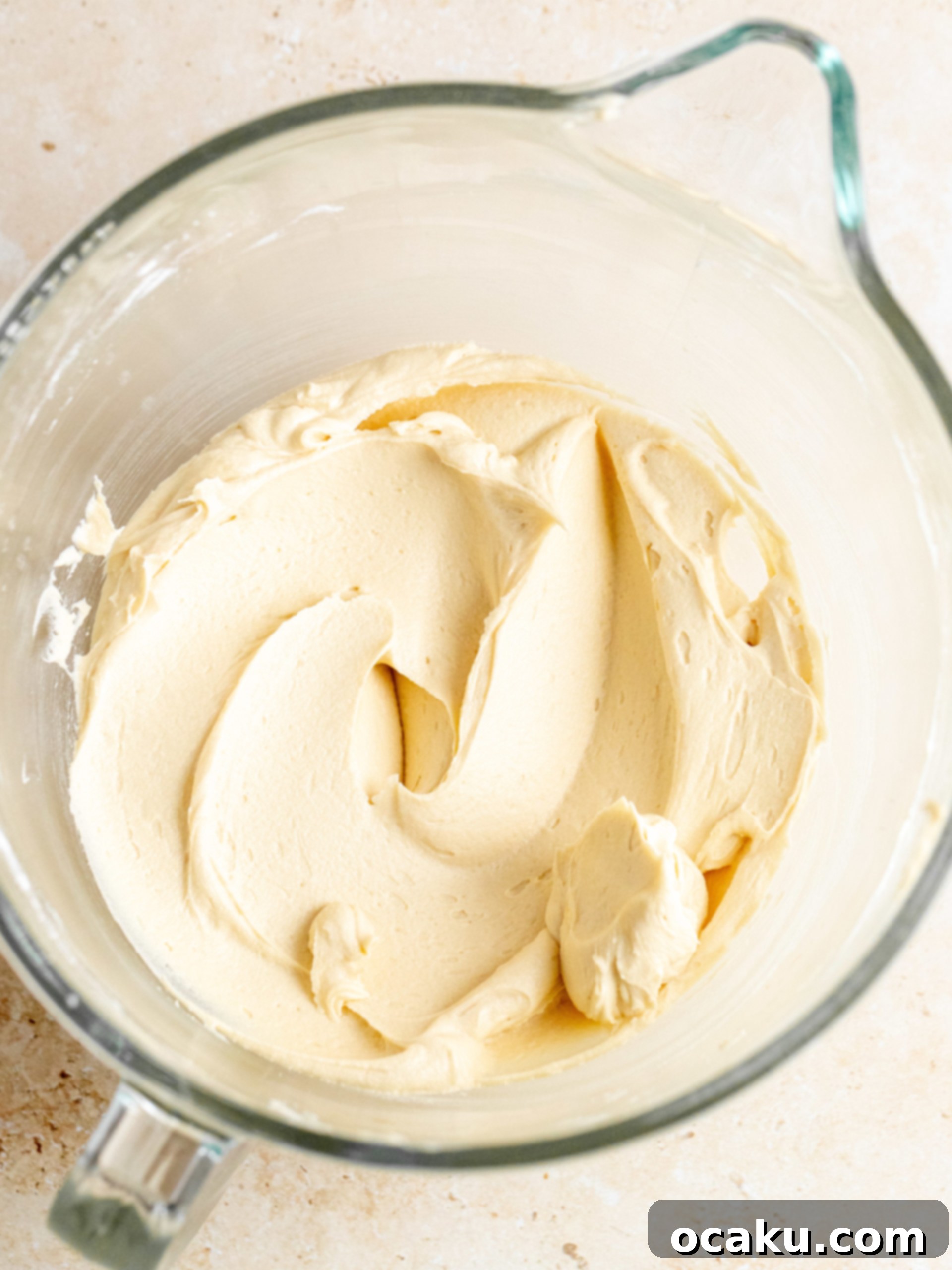 Coffee mixture being added to the buttercream ingredients.