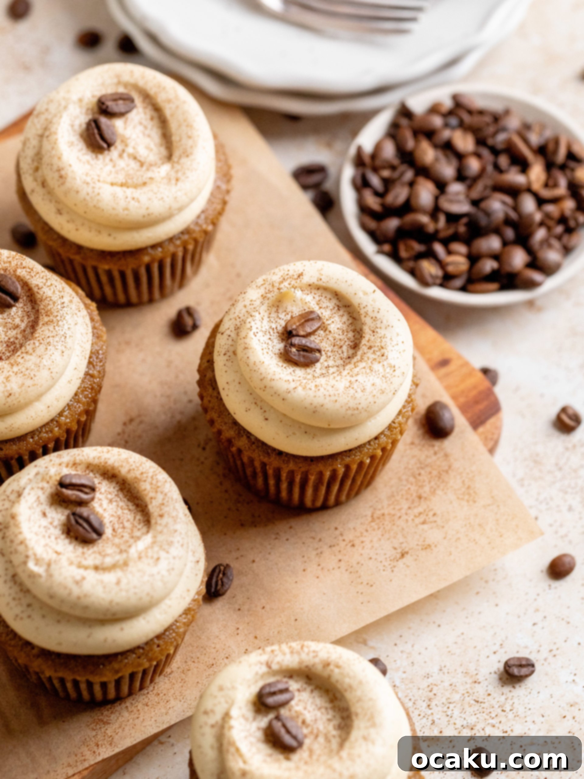Beautifully piped coffee buttercream on top of a coffee cupcake.