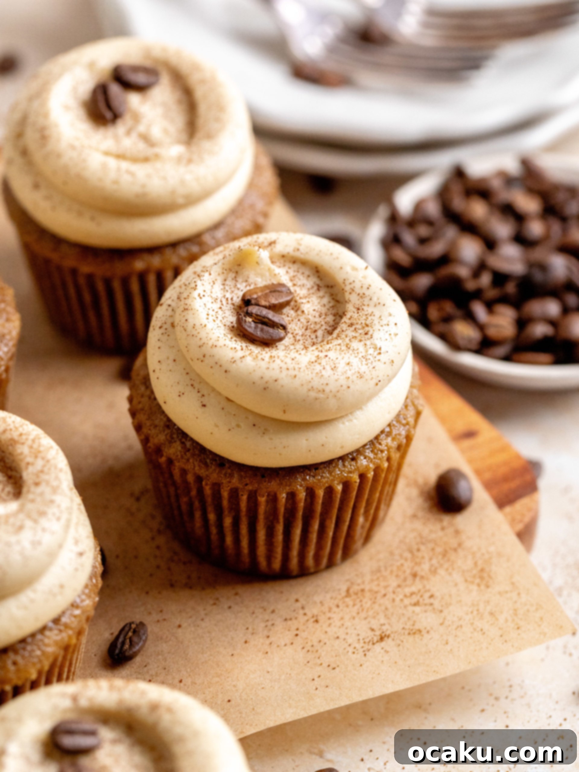 A row of beautifully frosted coffee cupcakes, ready to be enjoyed.