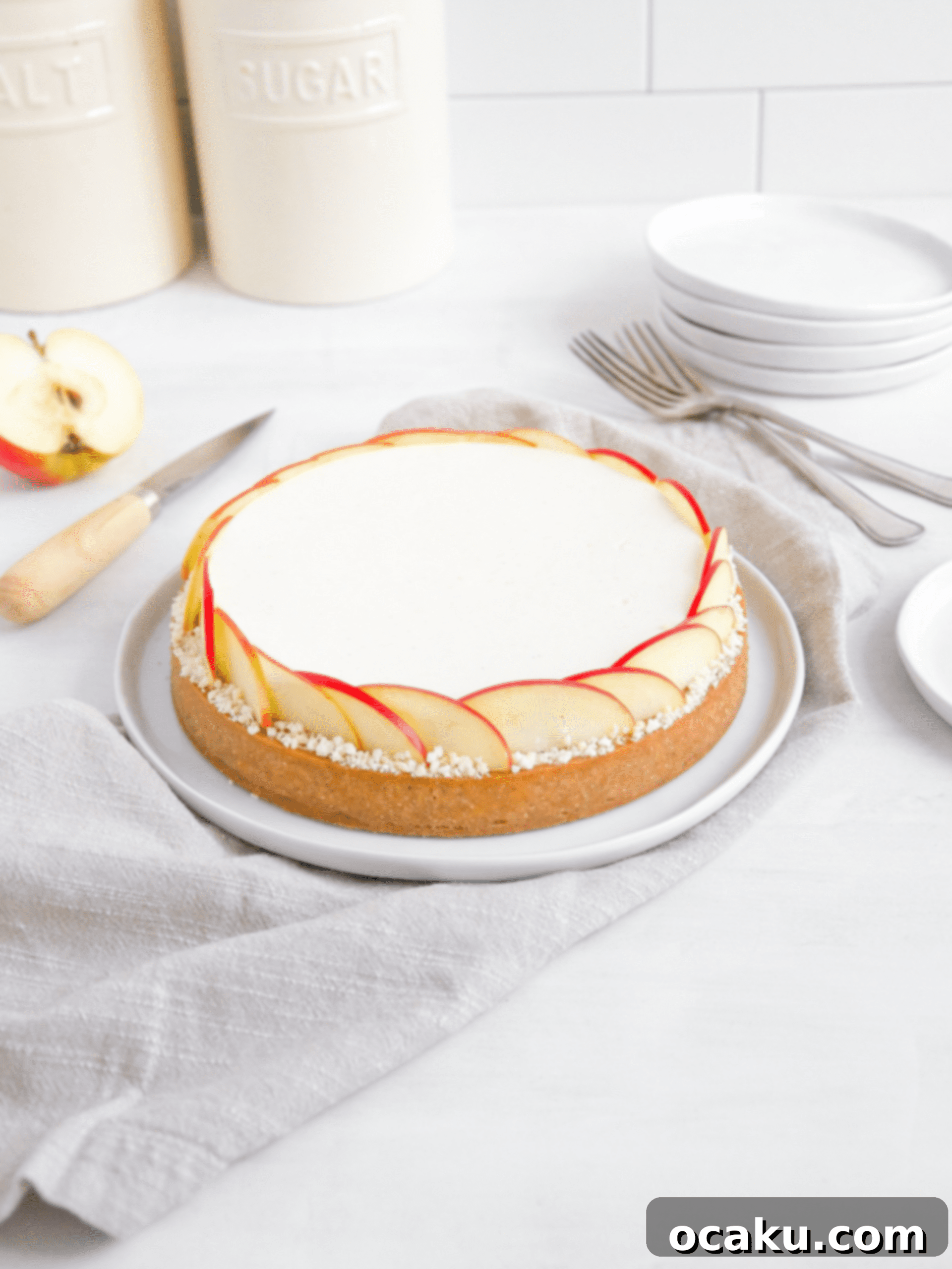 Close-up of a beautifully decorated apple mousse tart.