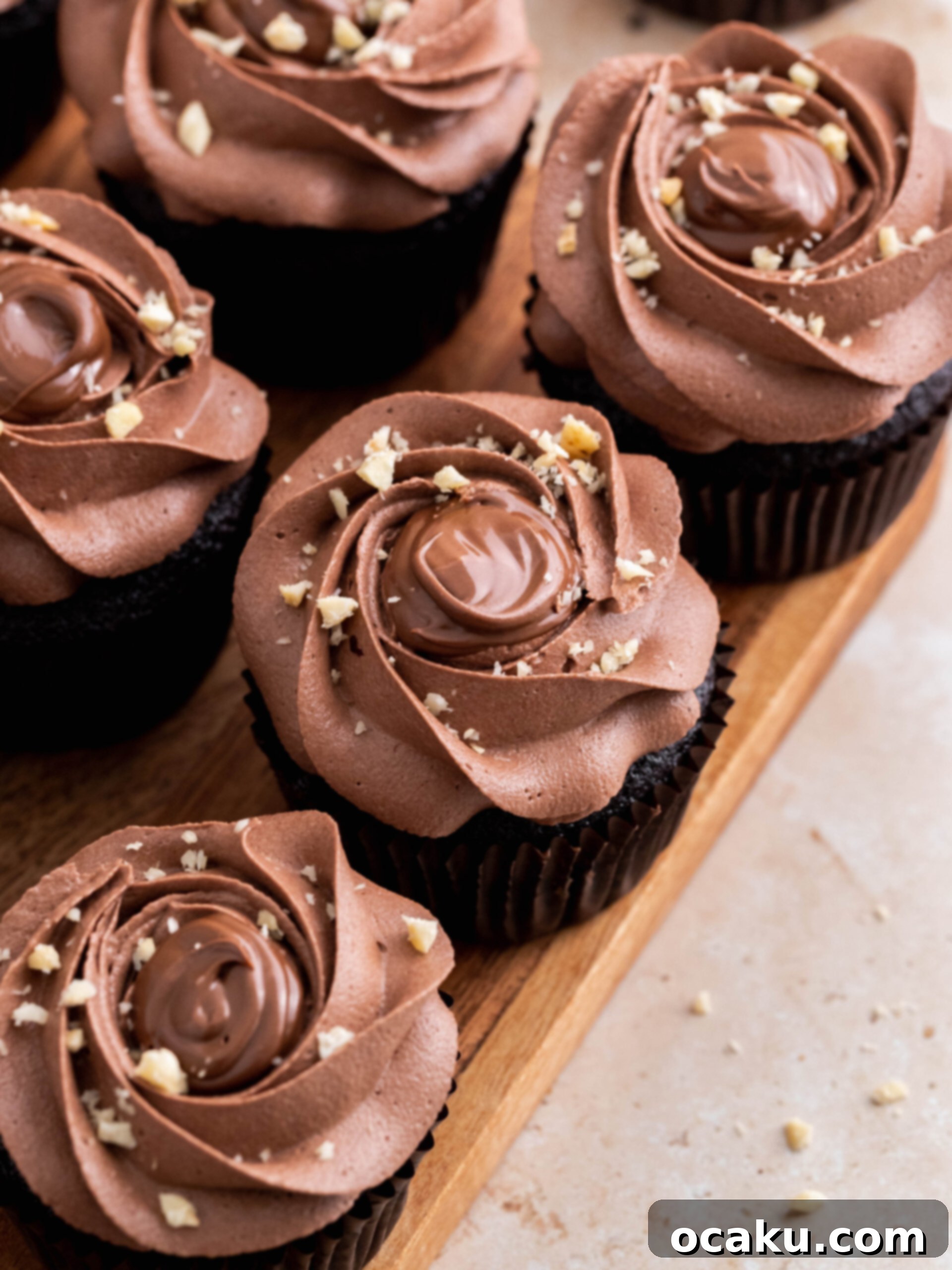 Super moist chocolate Nutella cupcakes with creamy Nutella buttercream and a sprinkle of hazelnuts on top.