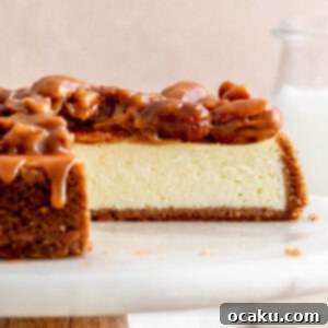 A slice of creamy Caramel Pecan Cheesecake