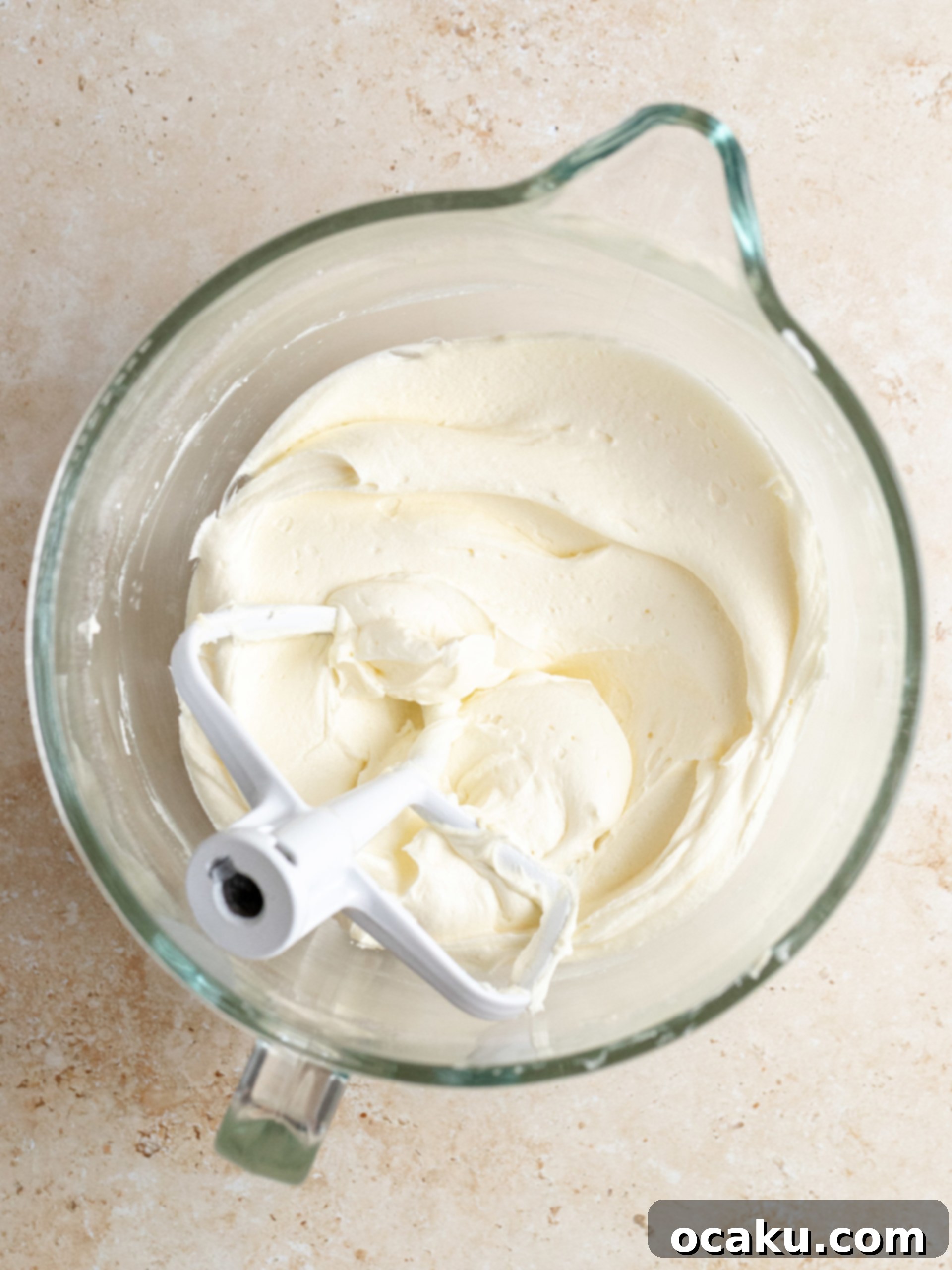 Decadent Cinnamon Cupcakes 7 Creamed butter in a stand mixer bowl, appearing light and fluffy.