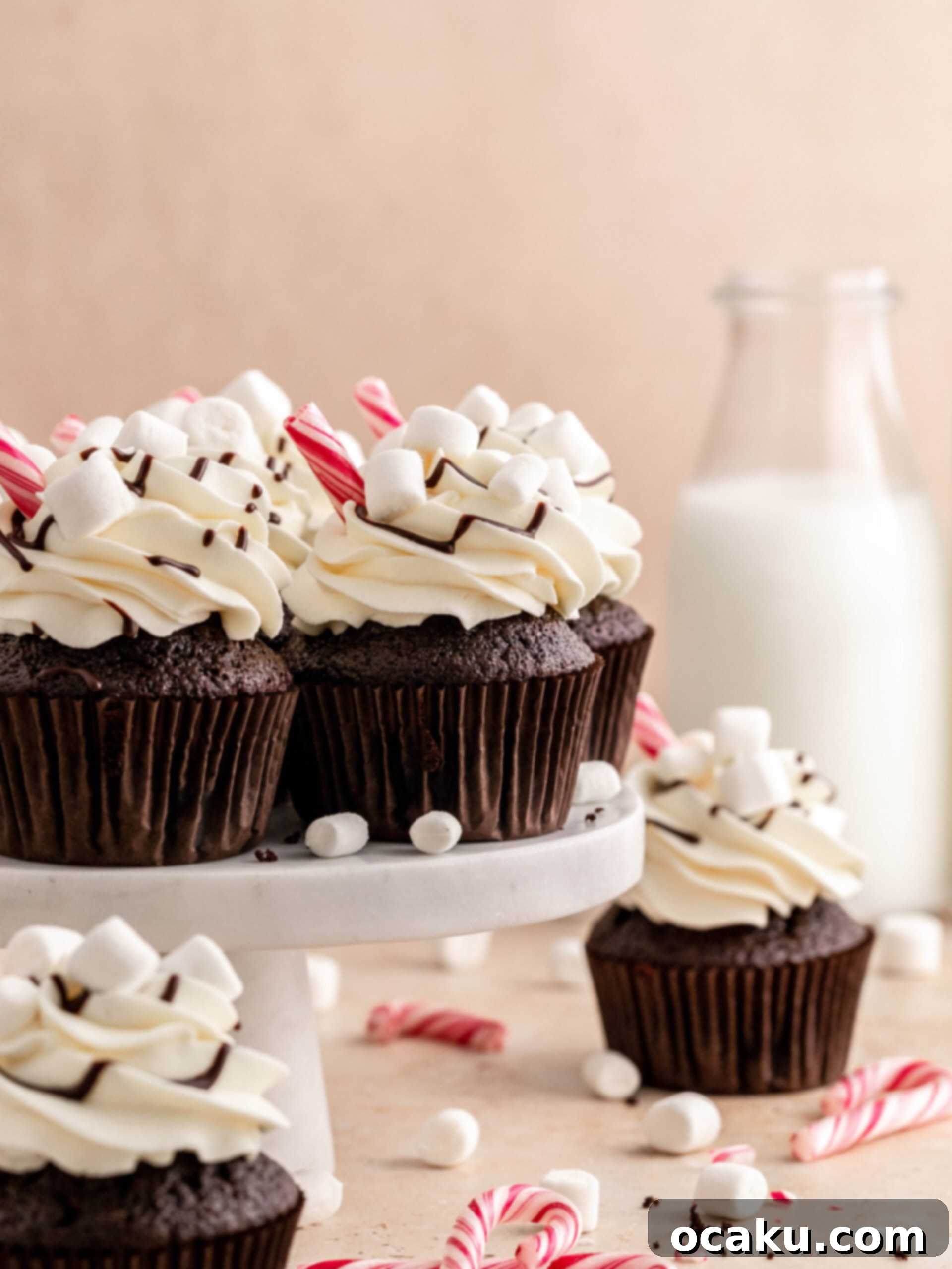 hot chocolate cupcakes on a cake stand.
