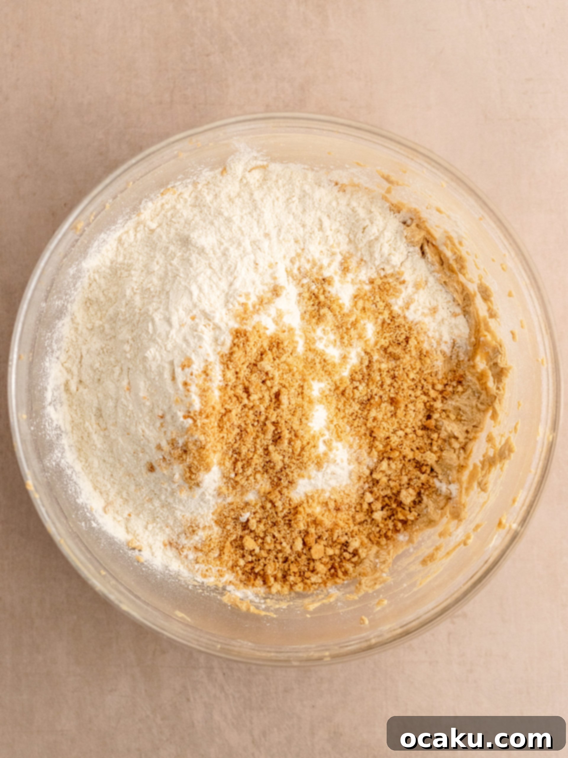 Scooped cookie dough balls on a parchment-lined baking sheet.