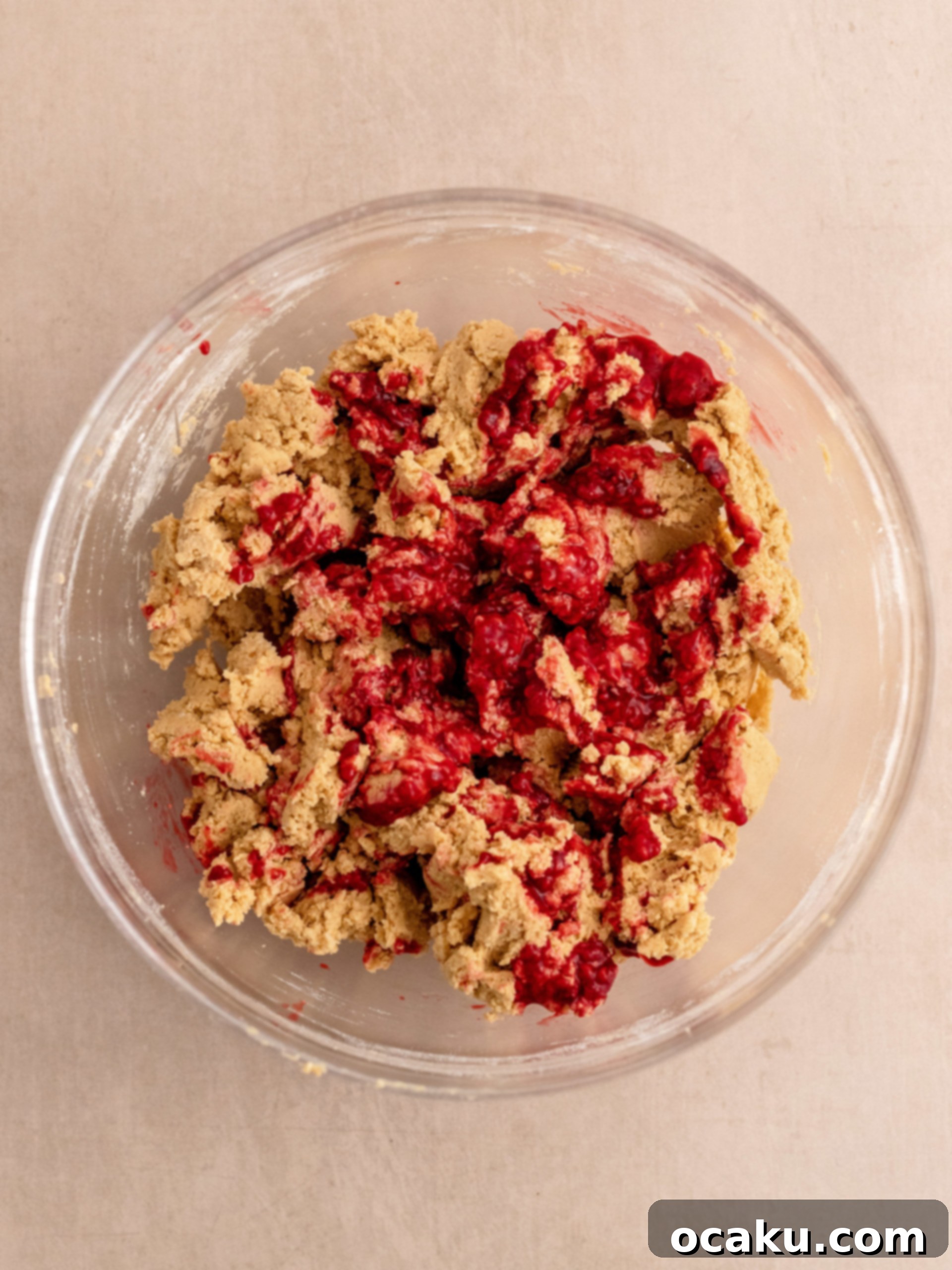 Close-up of baked cookies on a baking sheet, showing their soft centers.