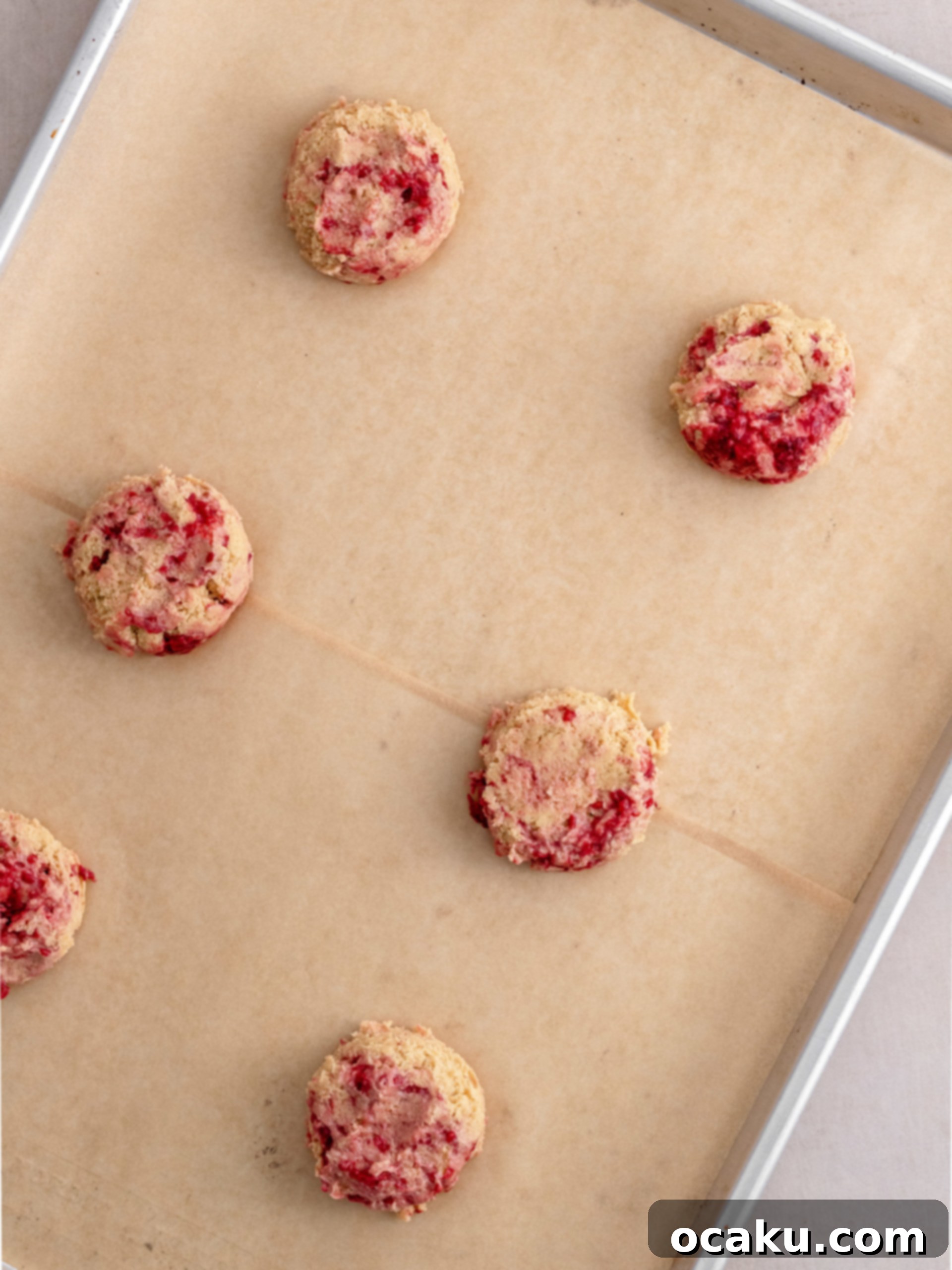 Transferring cooled cookies to a wire rack.
