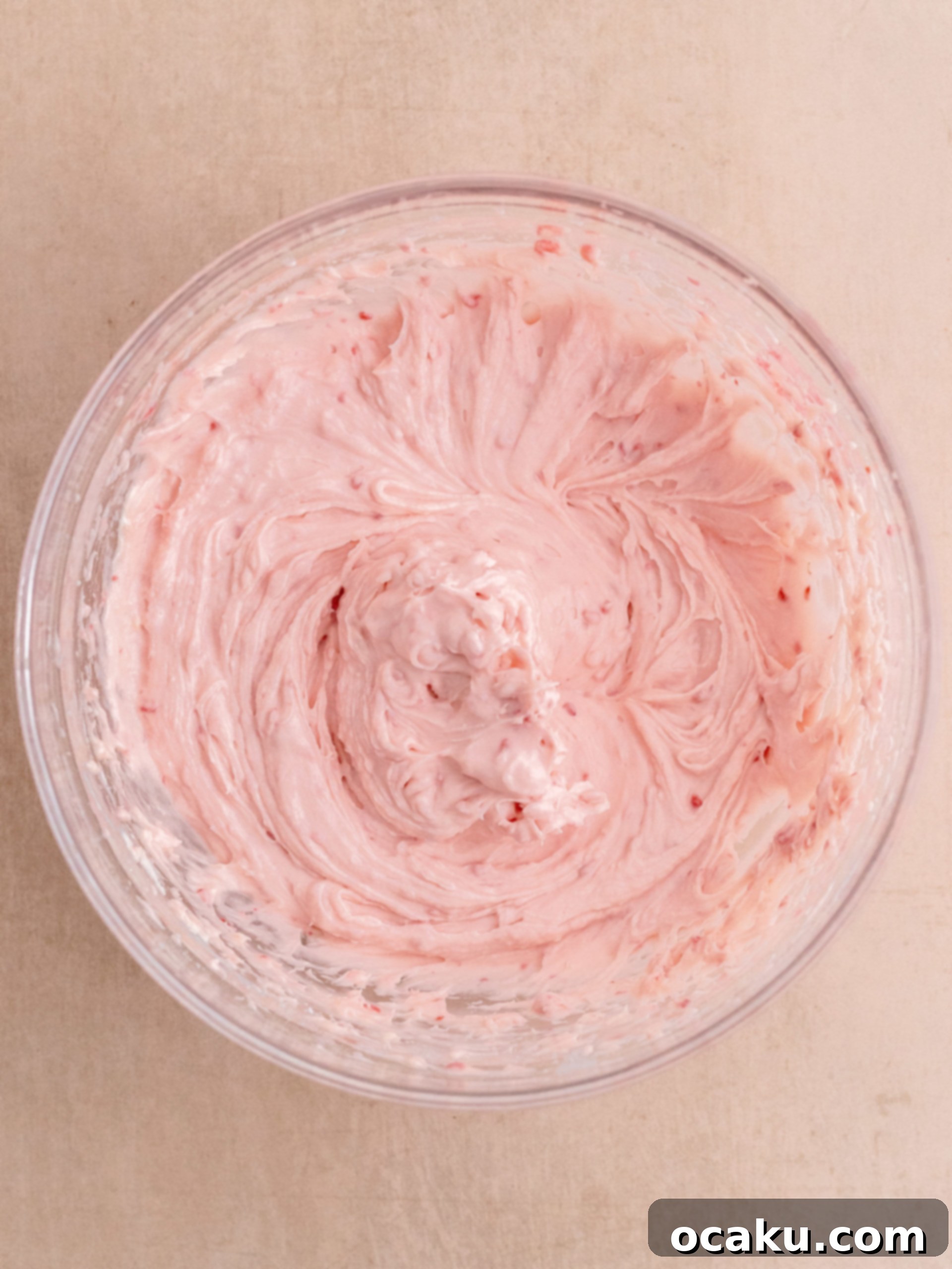 Finished raspberry cheesecake cookie with frosting and fresh raspberries.