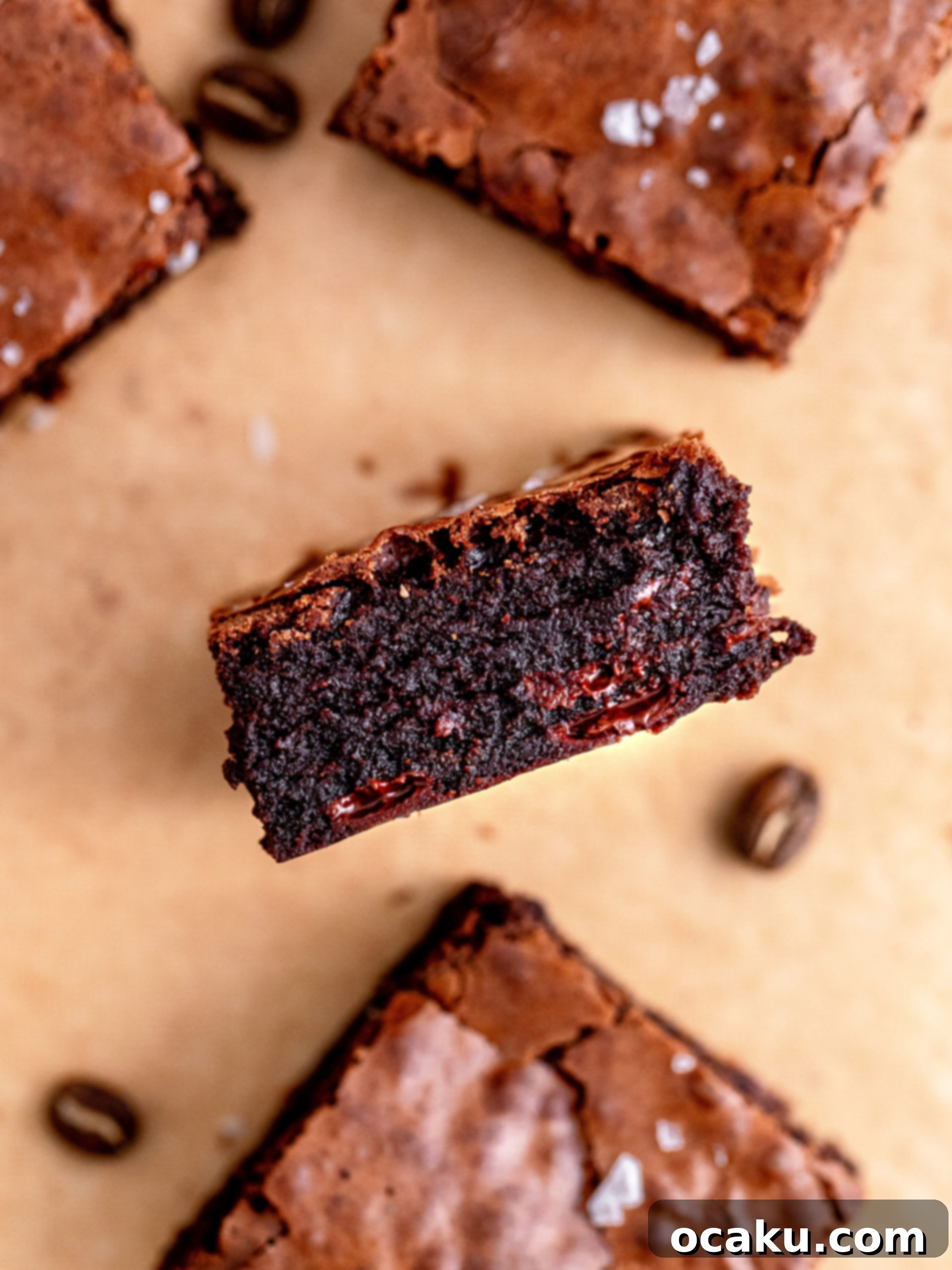 Several neatly cut espresso brownie squares stacked on a plate, ready to be served.
