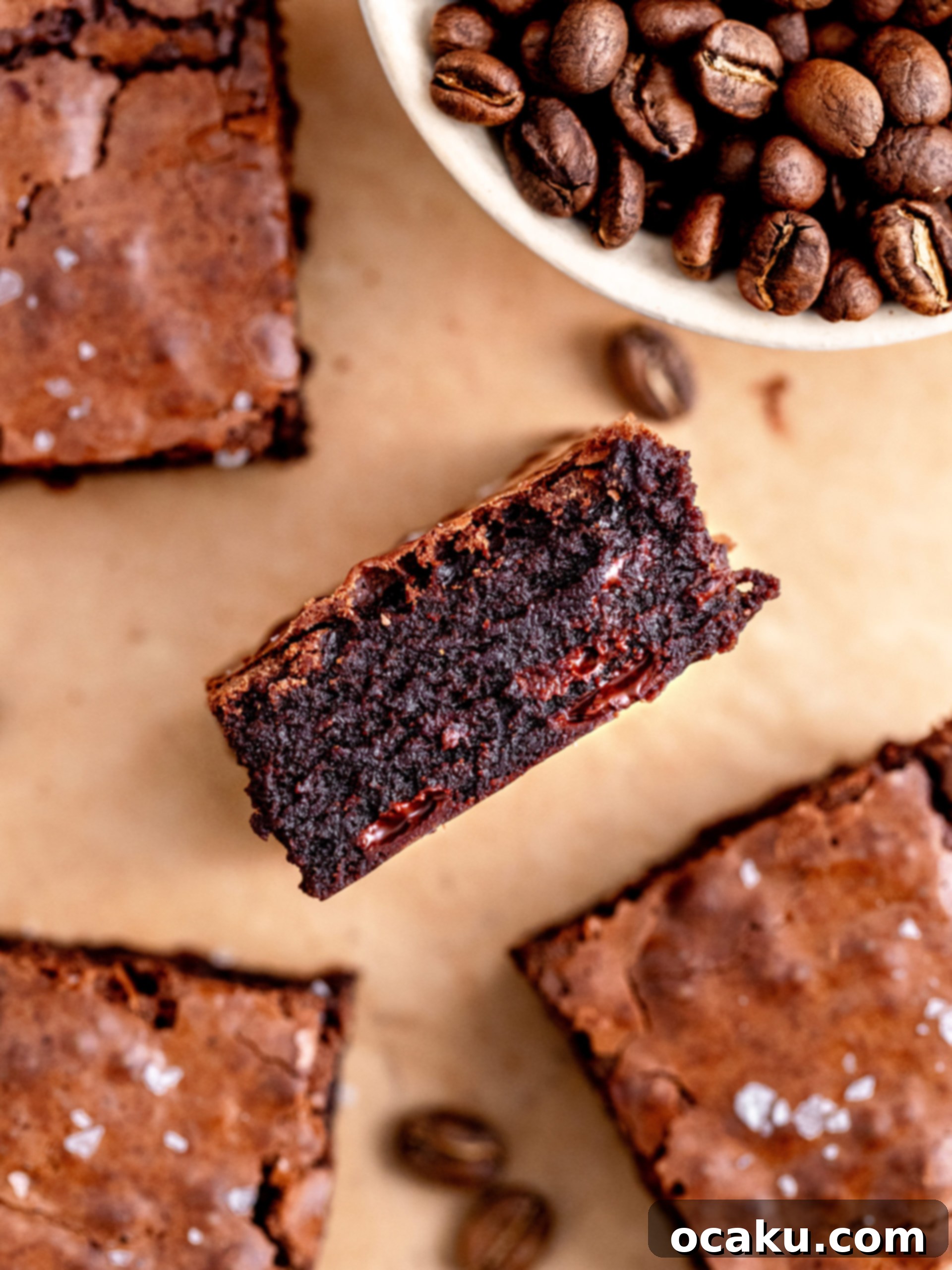Close-up of baked espresso brownies, showing the shiny, crinkly top texture.