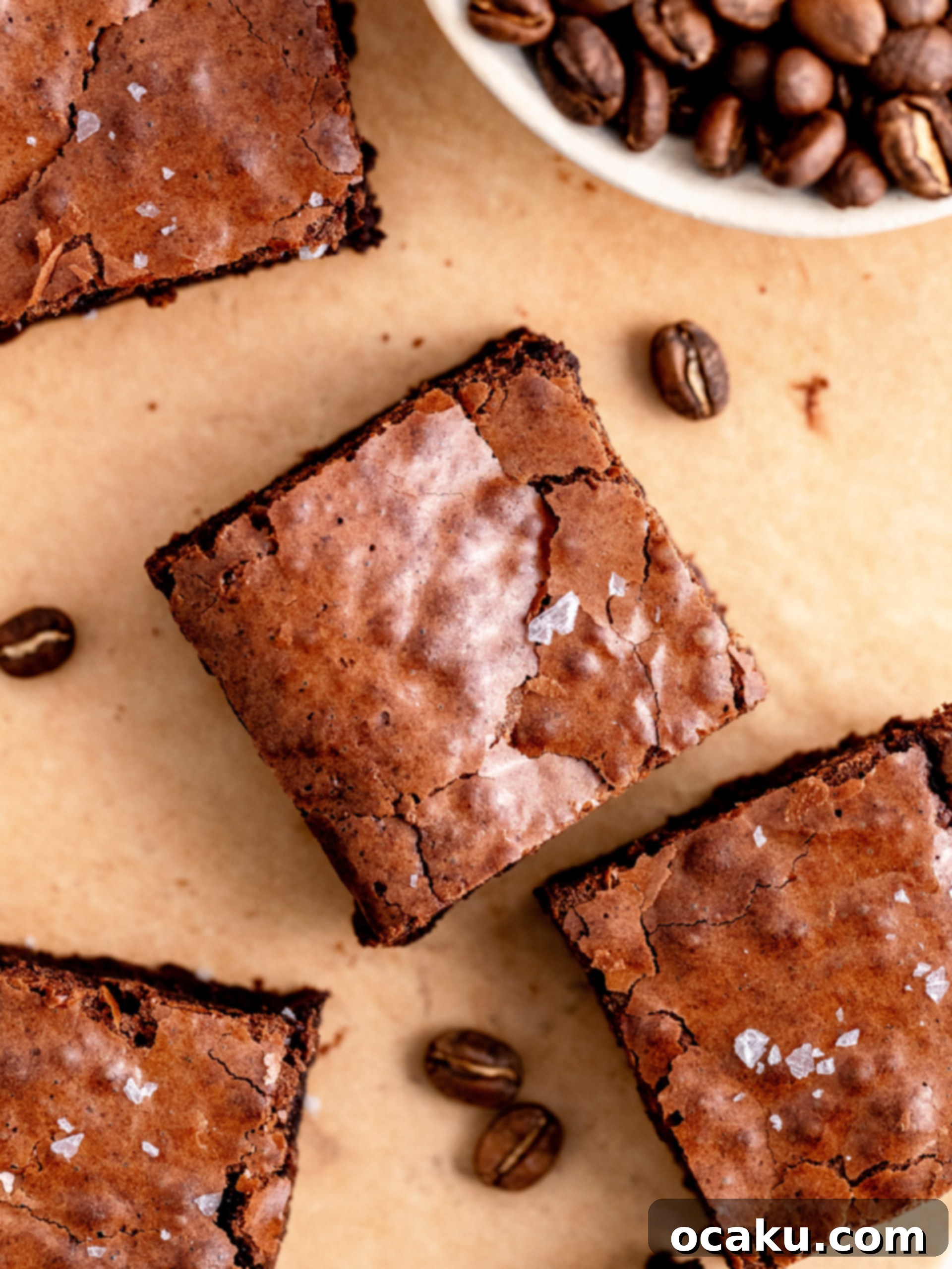 A large slab of espresso brownies, showcasing the rich texture and shiny top, ready to be cut.