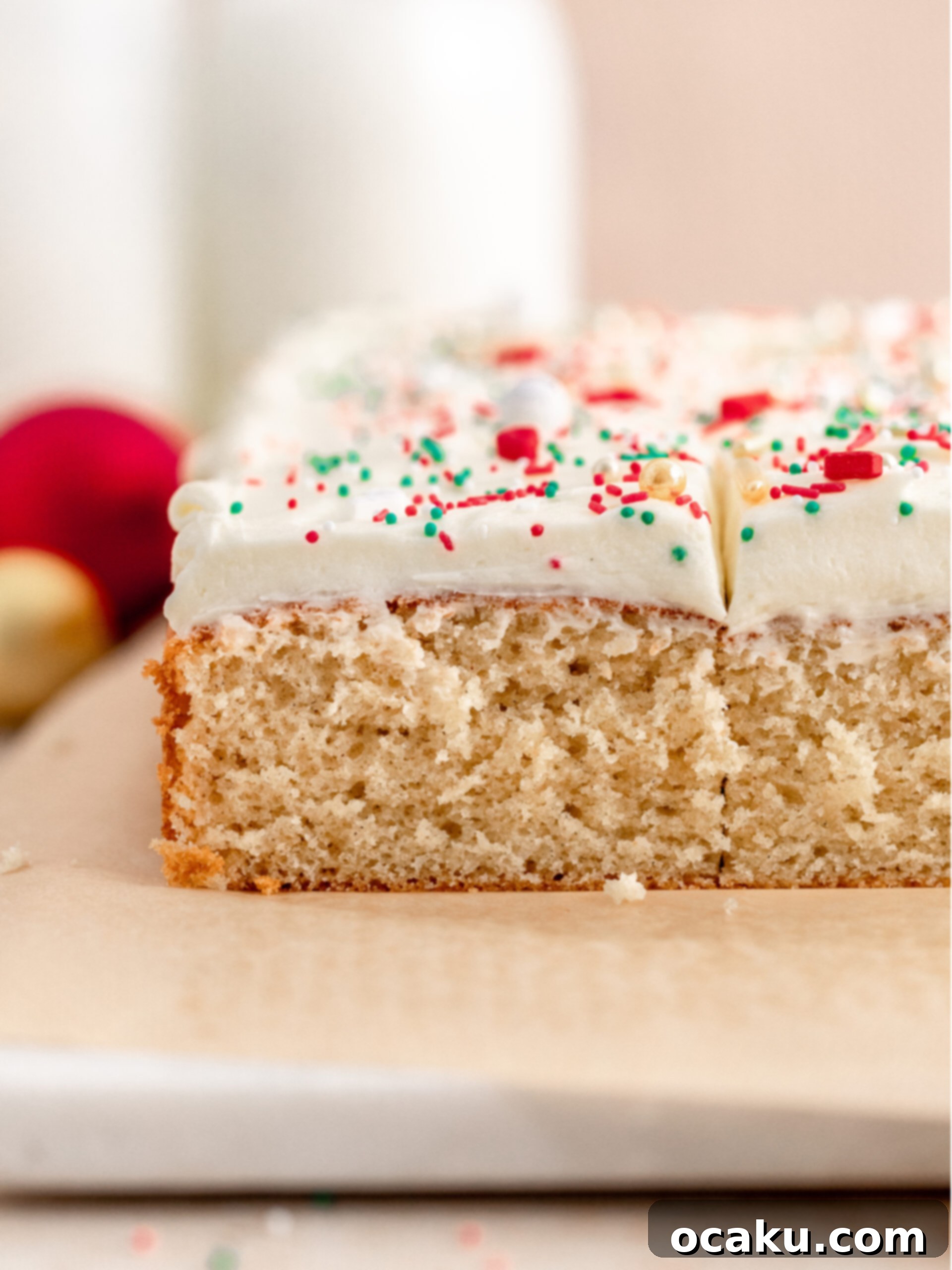 Cardamom cake with frosting, cut into perfect squares.