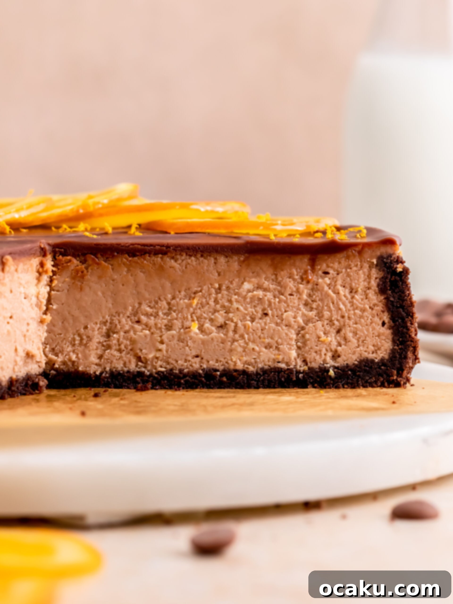 Decadent Chocolate Orange Cheesecake 10 A slice of chocolate orange cheesecake on a plate.