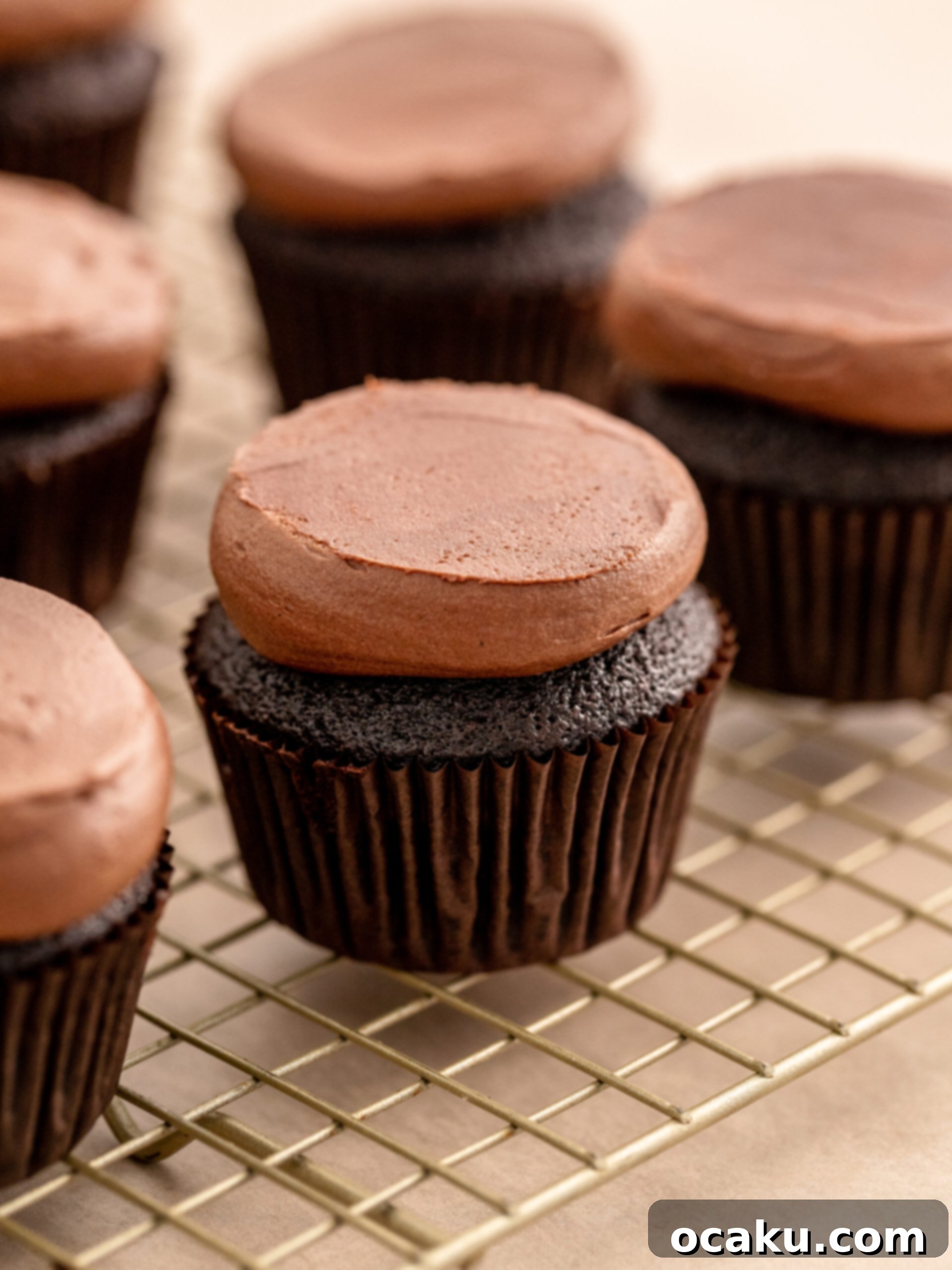 Decorating reindeer cupcakes with pretzel antlers and candy eyes.