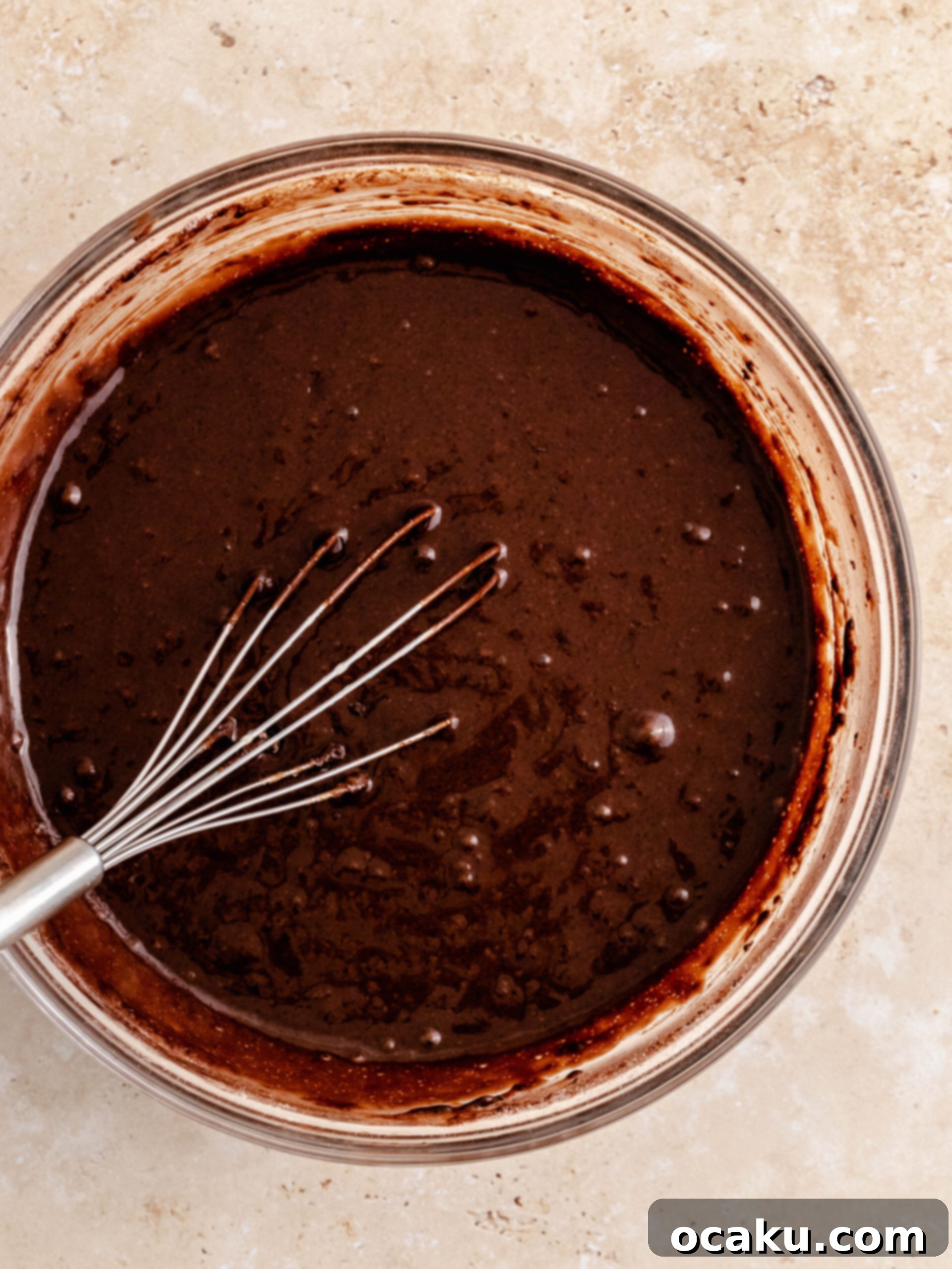 Combining wet and dry ingredients for cupcake batter.