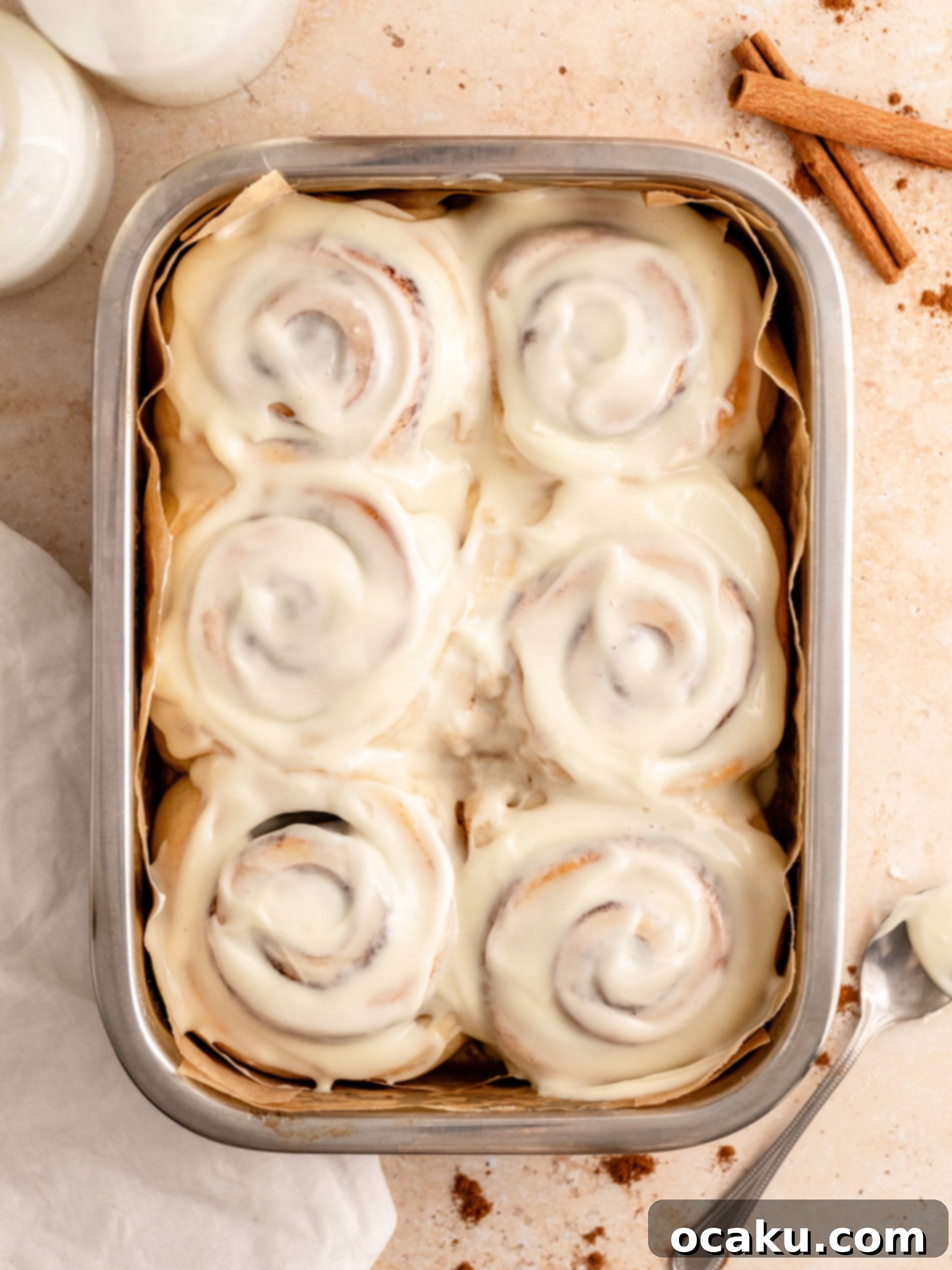 Perfectly Sized Cinnamon Rolls 2 Freshly baked small batch cinnamon rolls with cream cheese frosting, showing off their soft, fluffy texture