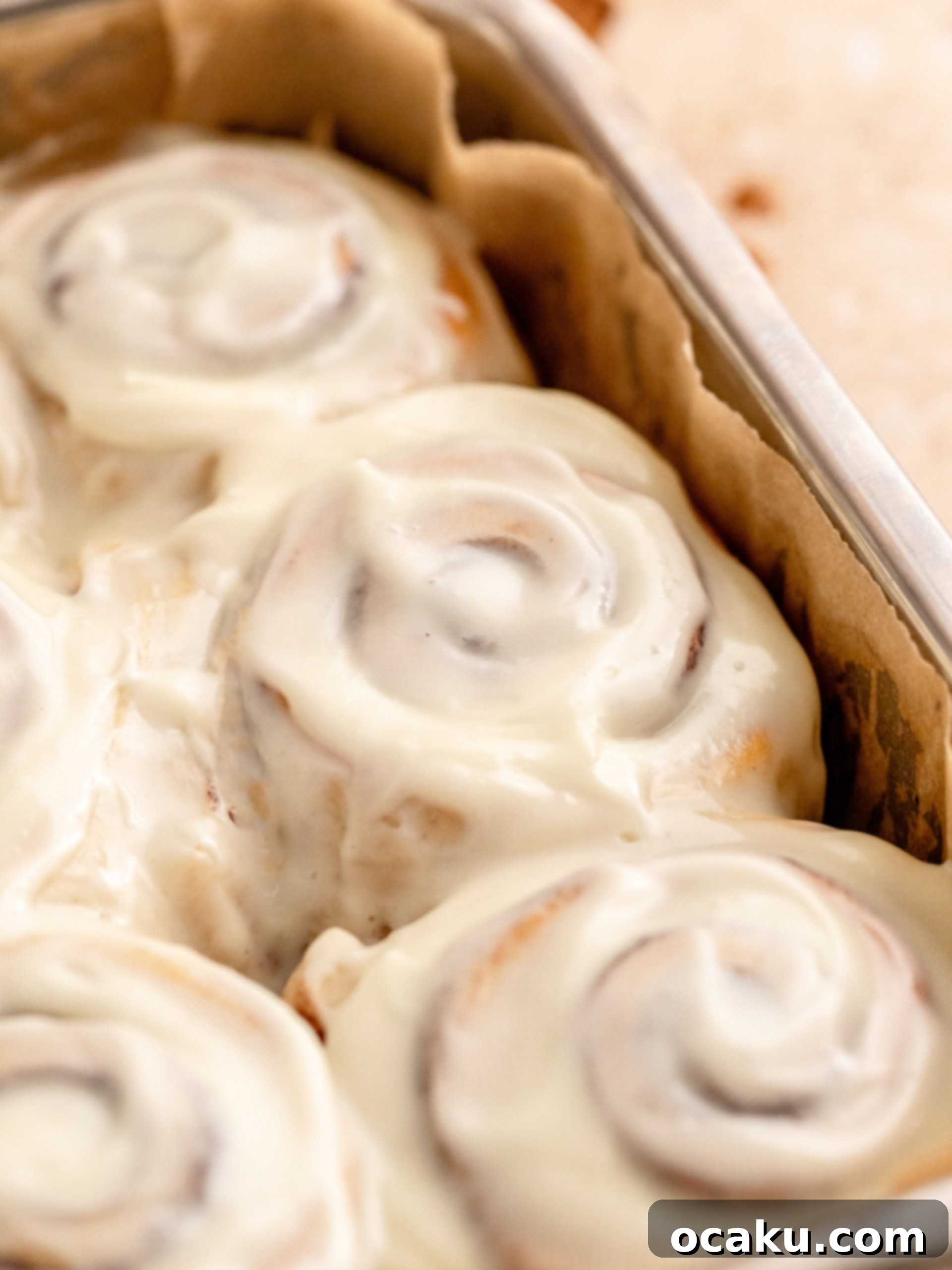 Small Batch Cinnamon Rolls Close-up of baked small batch cinnamon rolls in a baking dish, before frosting.