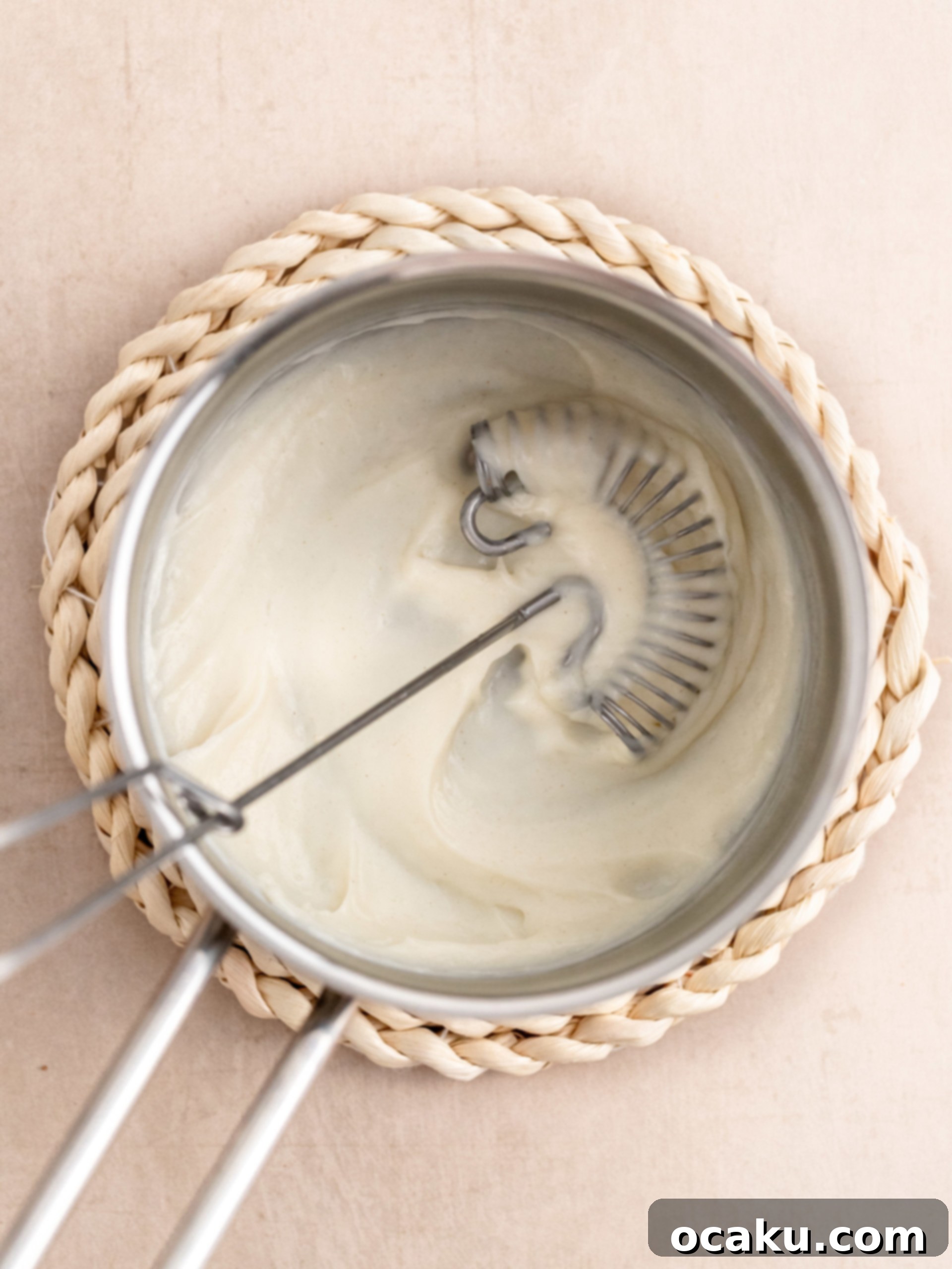 Perfectly Sized Cinnamon Rolls 3 Tangzhong slurry in a saucepan, being stirred to thicken.