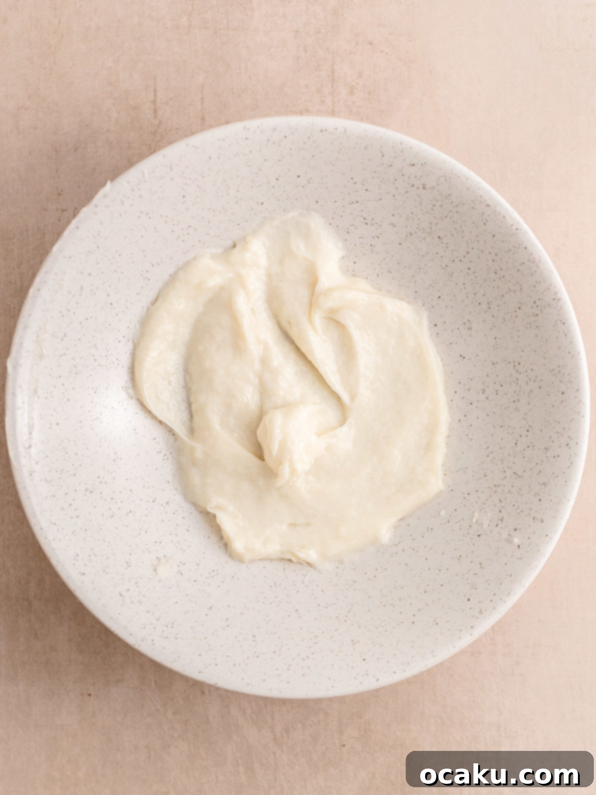 Perfectly Sized Cinnamon Rolls 4 Yeast dissolving in warm milk in a mixing bowl.