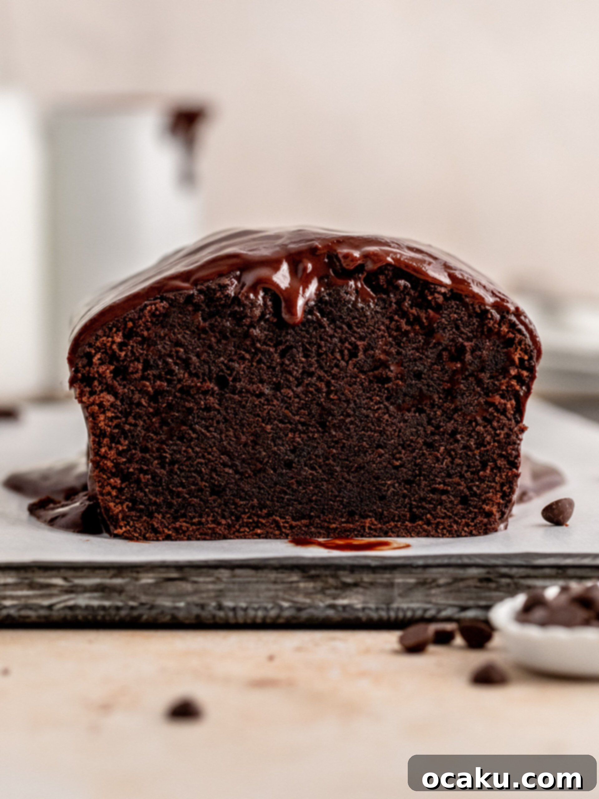 Decadent Chocolate Sour Cream Pound Cake 2 A slice of moist chocolate sour cream pound cake topped with glossy chocolate ganache.
