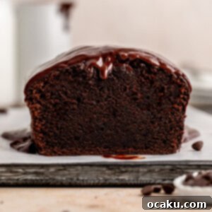 Decadent Chocolate Sour Cream Pound Cake 13 Chocolate Sour Cream Pound Cake topped with ganache.