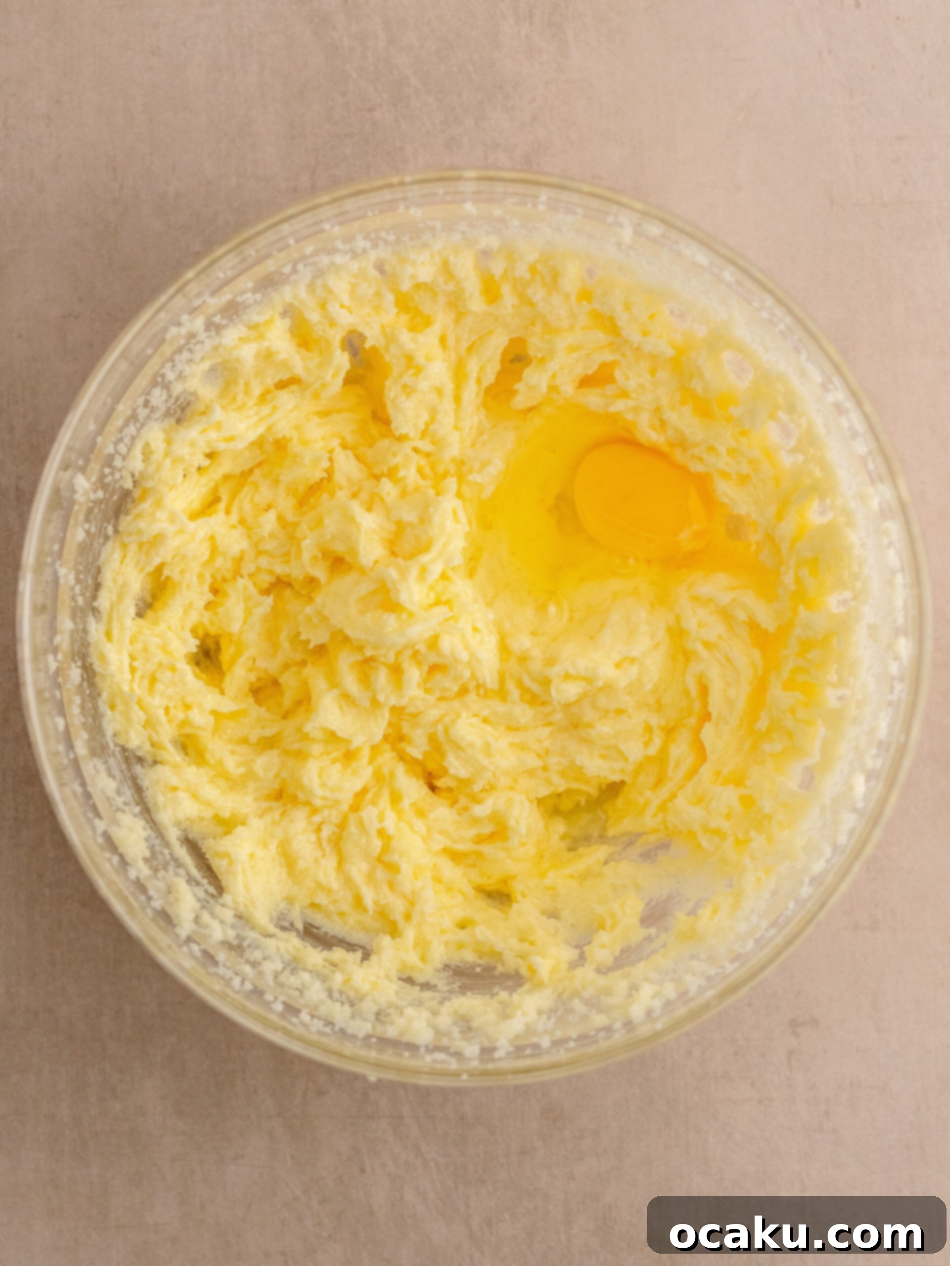 Decadent Chocolate Sour Cream Pound Cake 3 Image showing butter and sugar being creamed in a stand mixer.