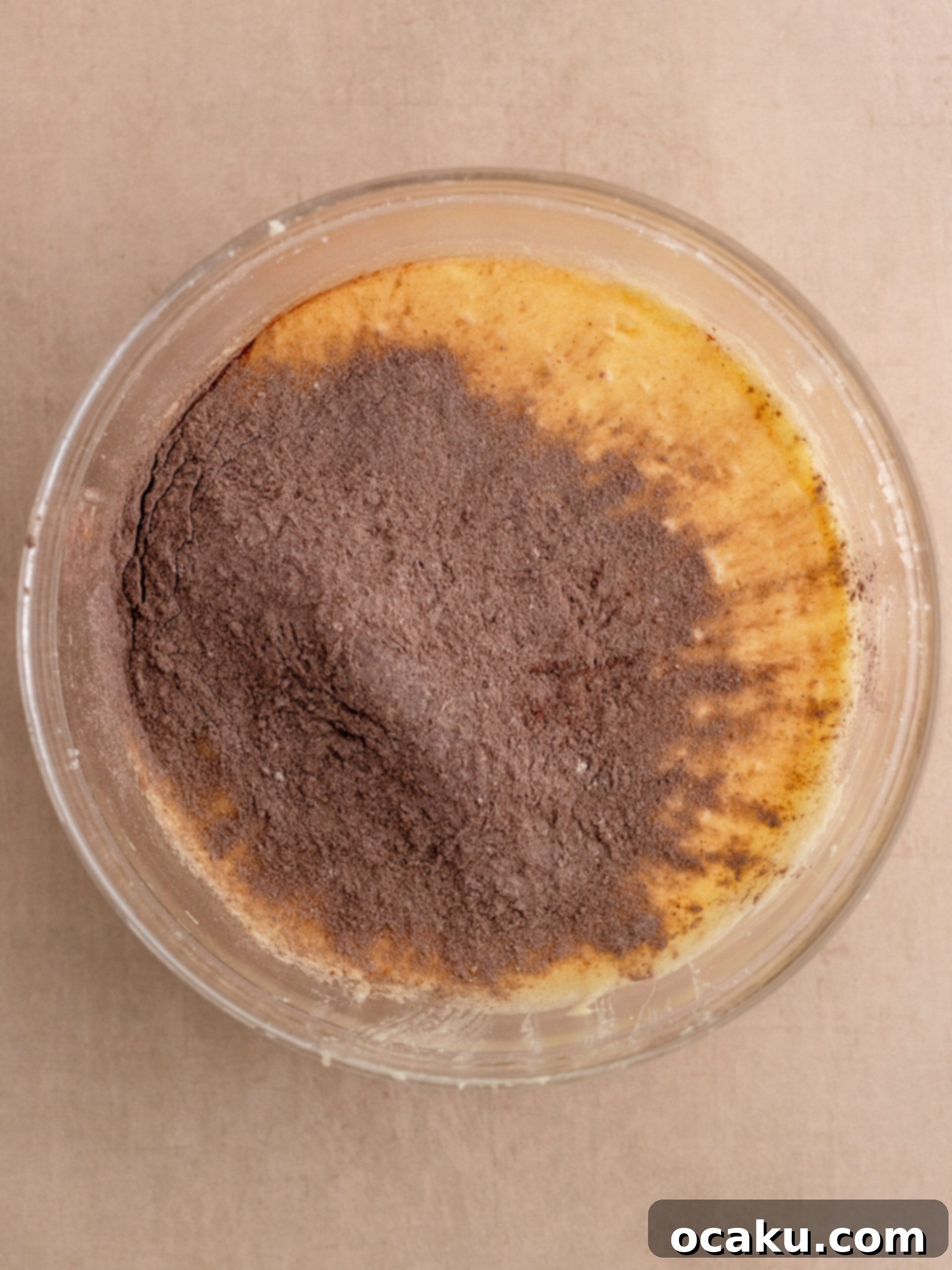 Decadent Chocolate Sour Cream Pound Cake 4 Image showing eggs being added one by one to the creamed mixture.