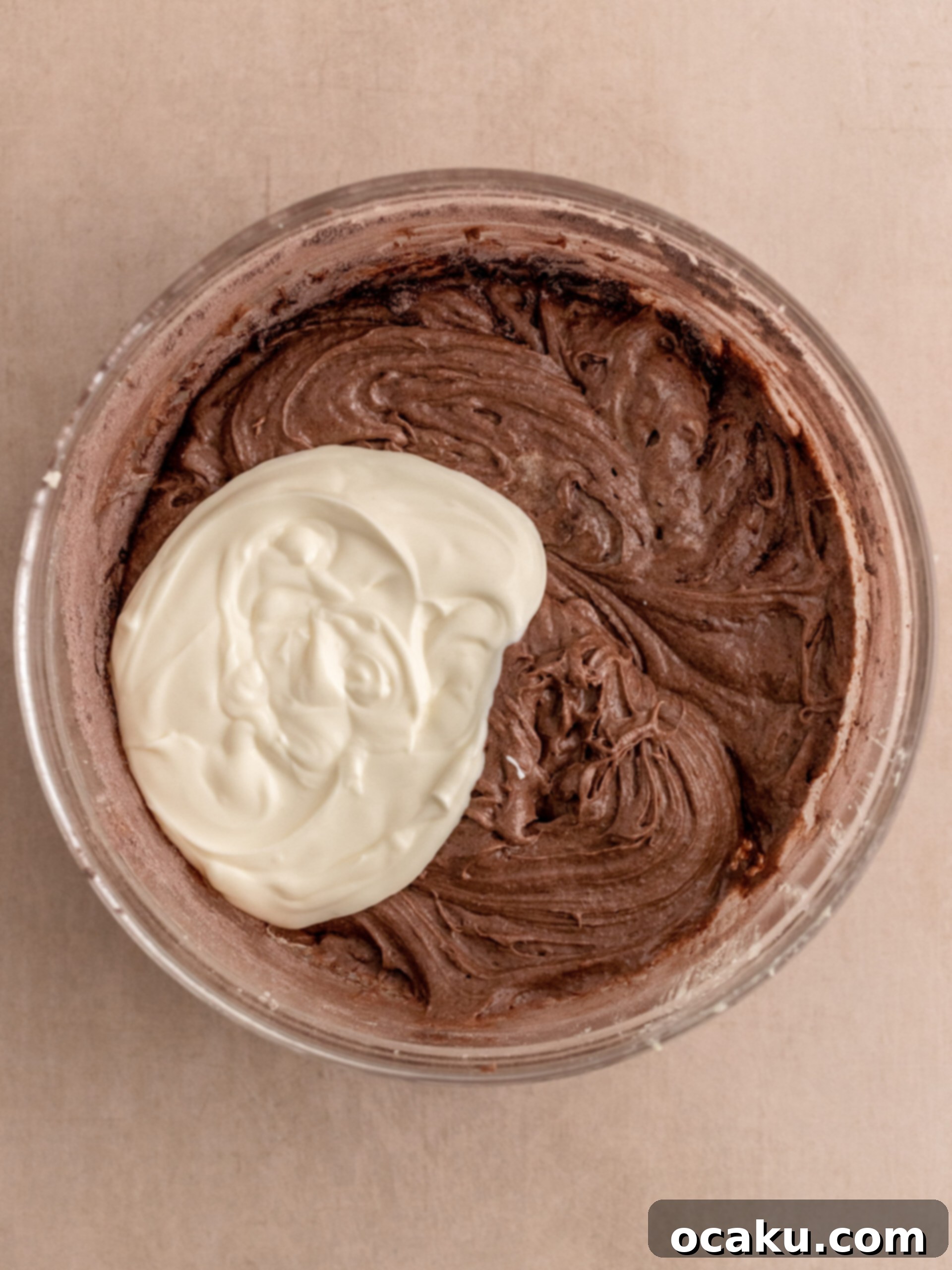 Decadent Chocolate Sour Cream Pound Cake 5 Image showing half of the flour mixture being added to the batter.