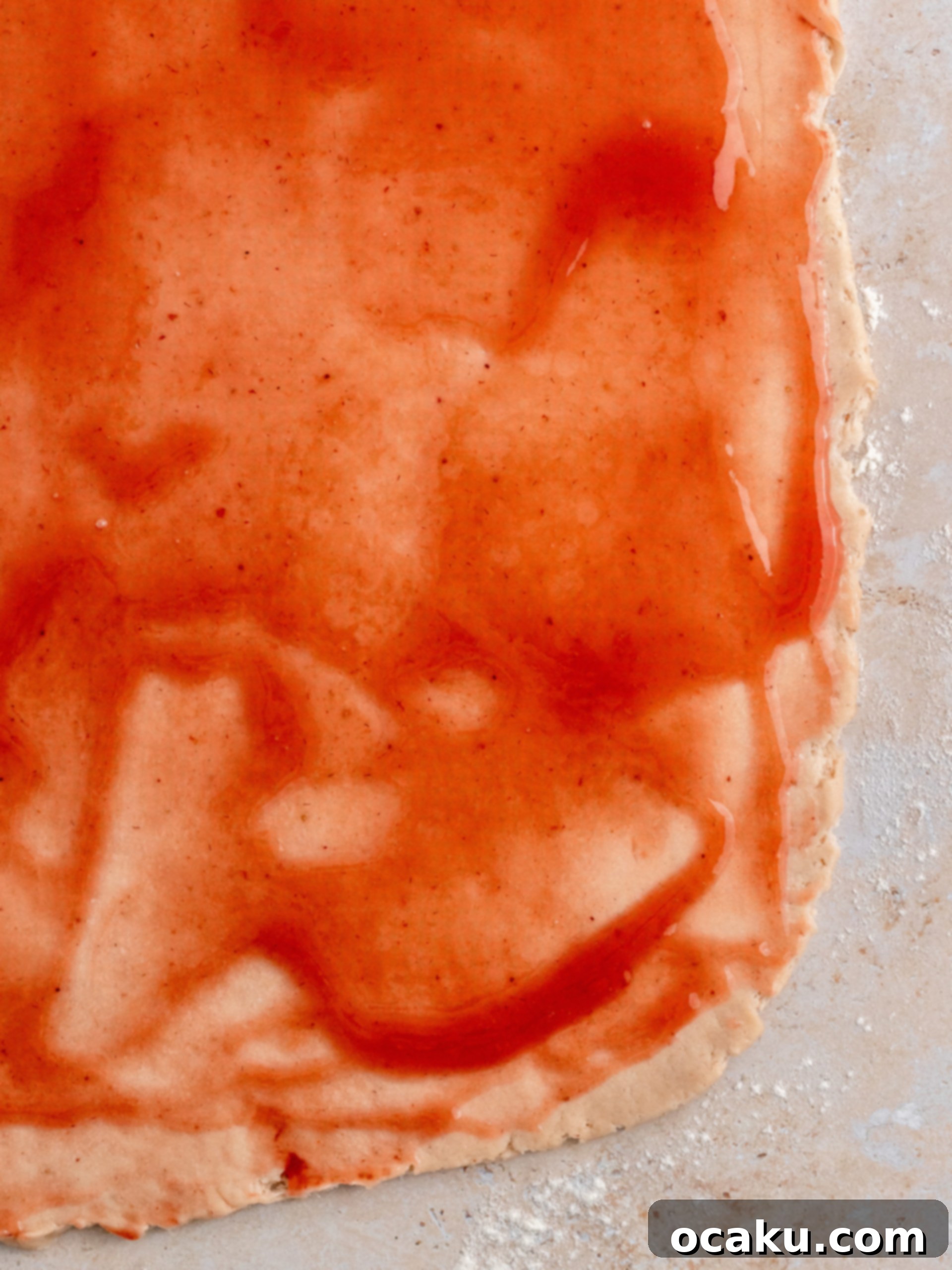 A freshly baked pan of golden-brown strawberry rolls, perfectly risen and ready for frosting.