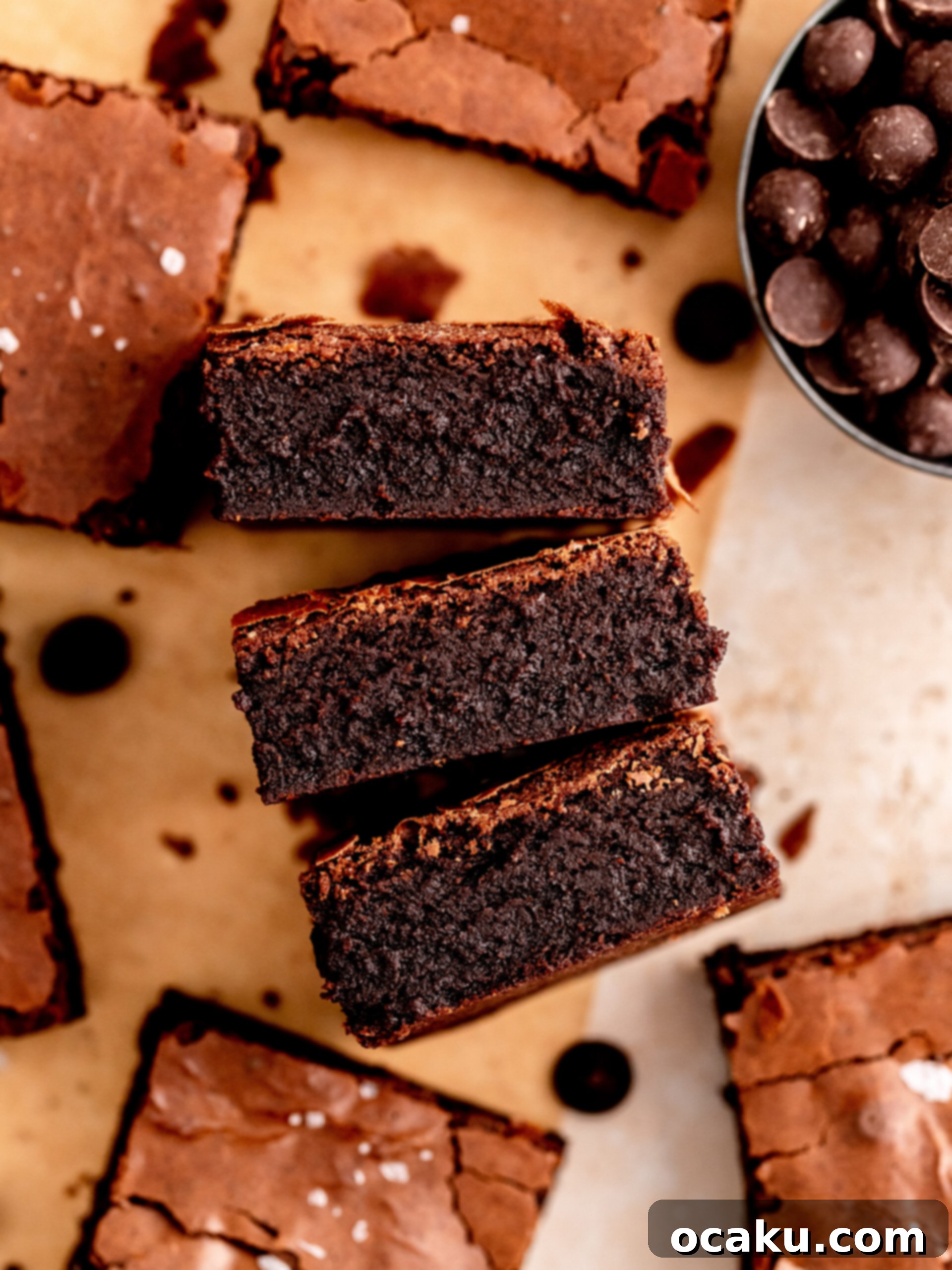 A freshly baked, fudgy dairy-free brownie with a perfect crackly top, ready for slicing.