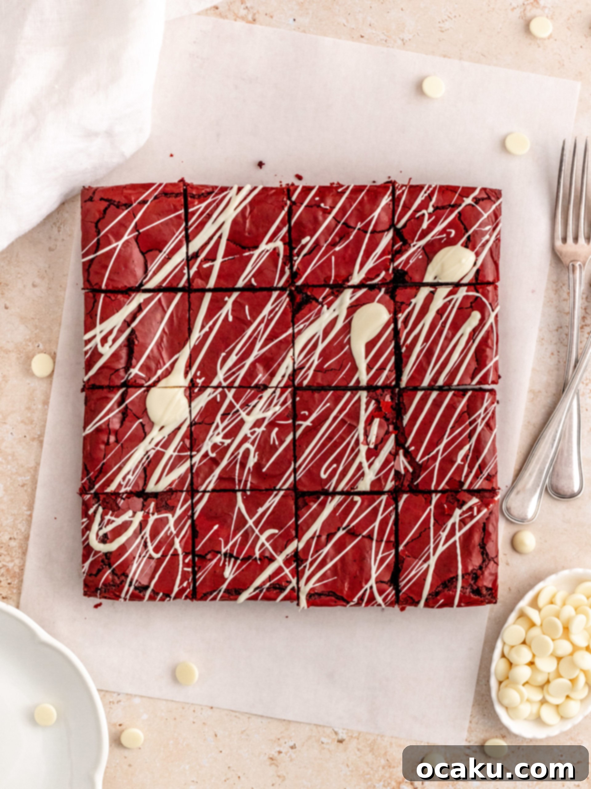 Aperol Spritz Cheesecake Close-up of a perfectly fudgy Red Velvet Brownie with a crinkly top and white chocolate drizzle