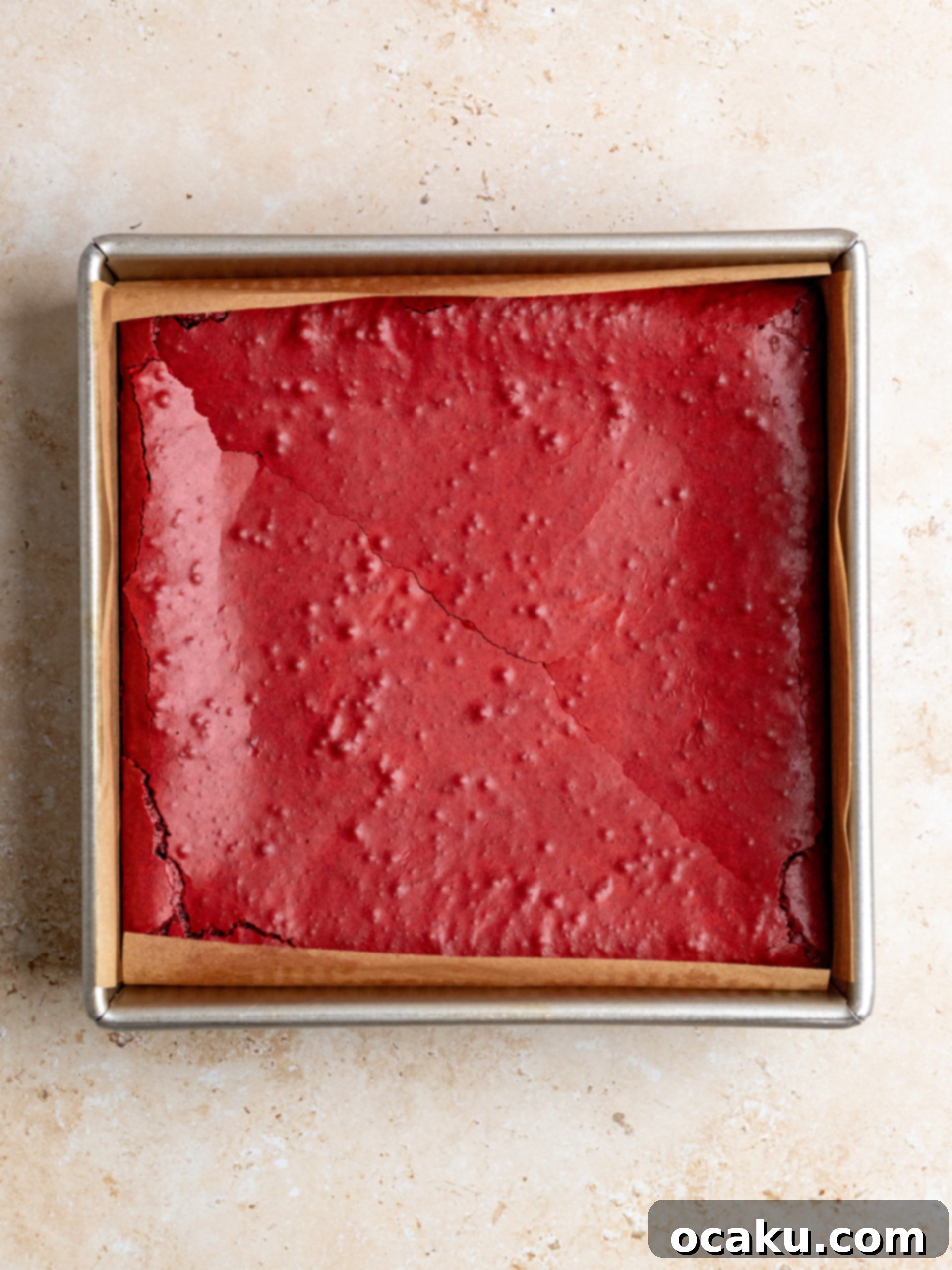 Decadent Red Velvet Brownies 5 Red Velvet brownie batter poured into a baking pan