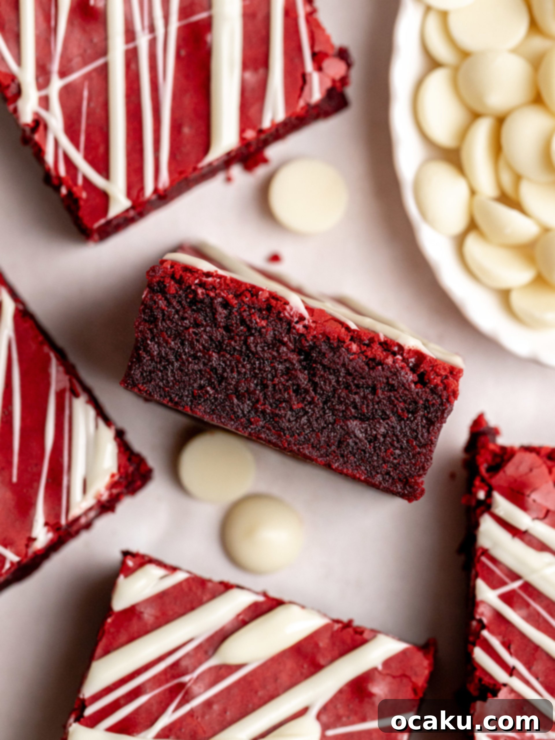Decadent Red Velvet Brownies 8 Red Velvet Brownies with white chocolate drizzle, ready to be served