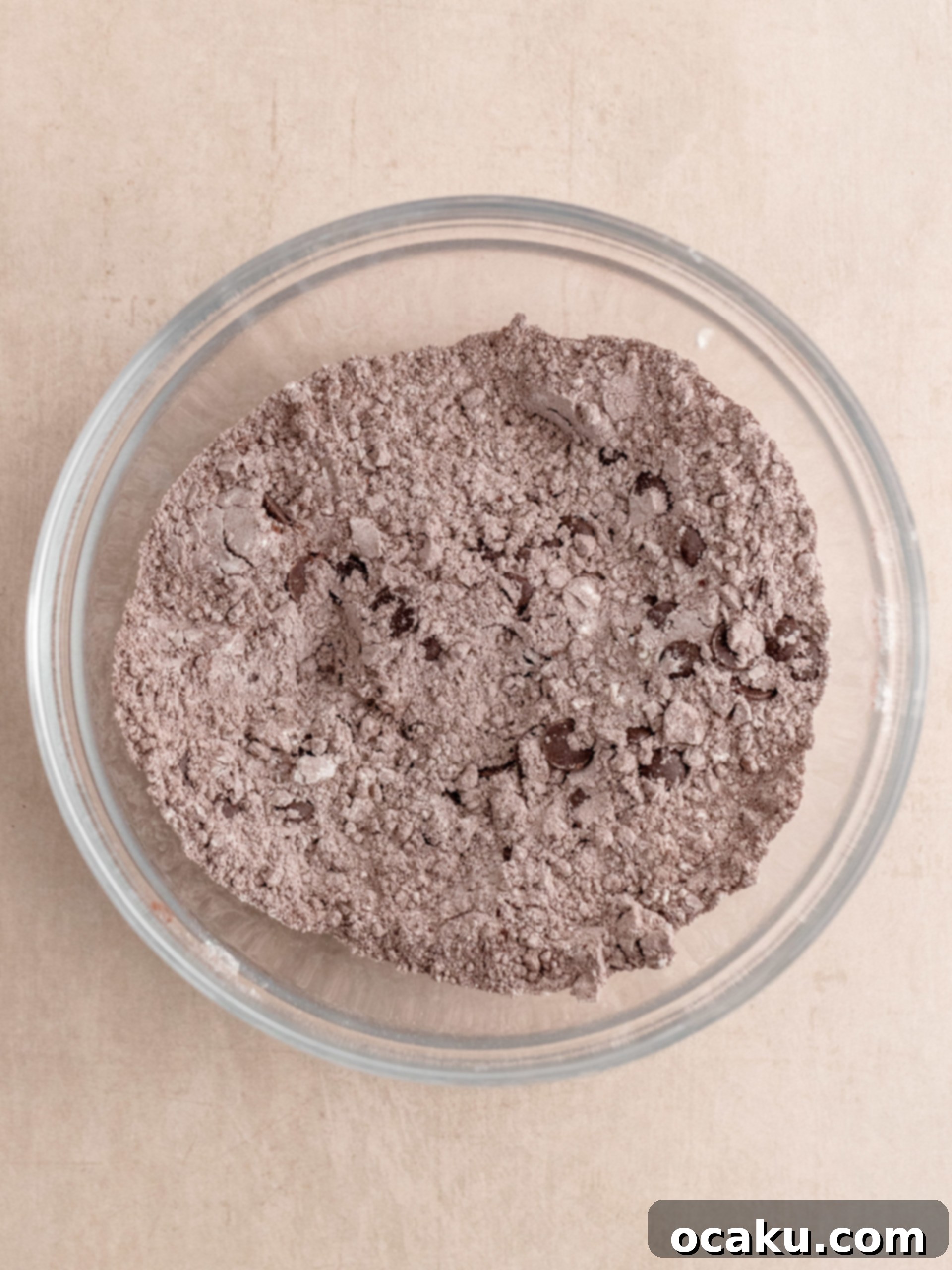 Dry ingredients being sifted for Triple Chocolate Muffins.