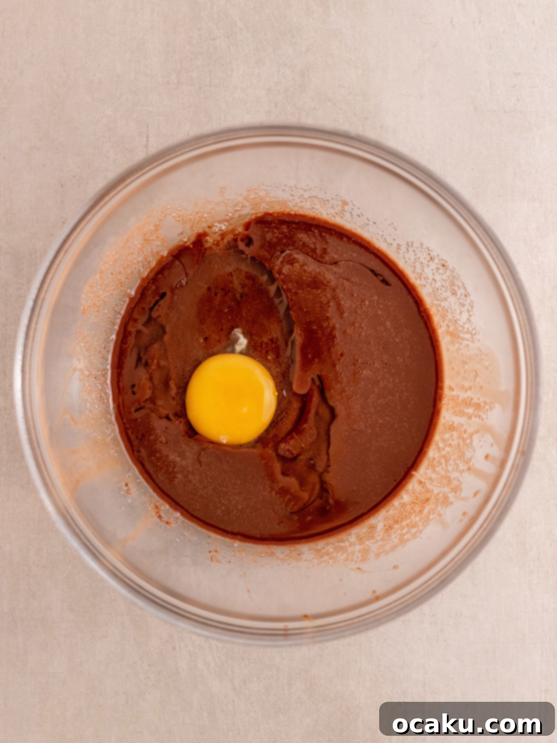 Mixing dry and wet ingredients gently for Triple Chocolate Muffins.